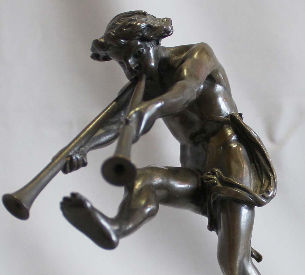 A charming patinated bronze figure of a piping satyr partly draped he dances upon a square plinth. Signed Bulio over a Sienna marble socle. Jean Ronald Bulio, French (1827-1911). Excellent movement , very nice patina. 