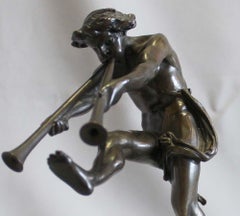 Bronze of a satyr playing pipes on Sienna marble base signed Bulio