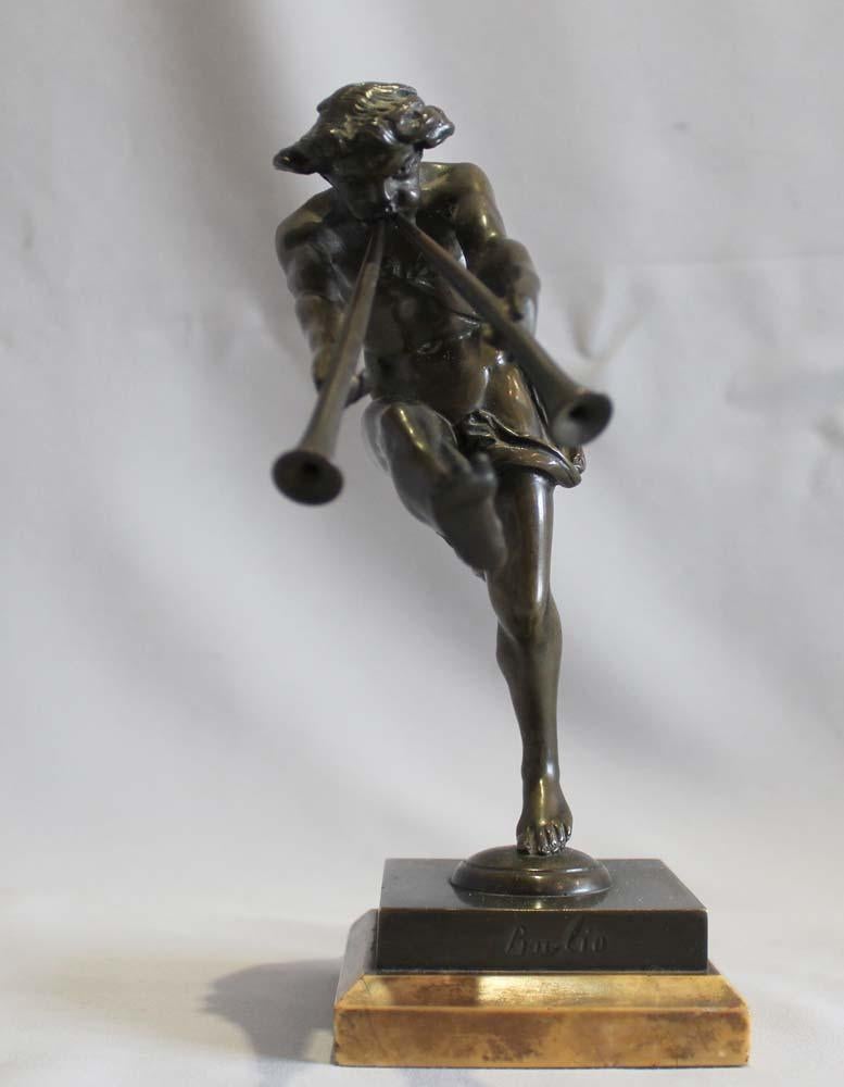 Patinated Bronze of a satyr playing pipes on Sienna marble base signed Bulio For Sale