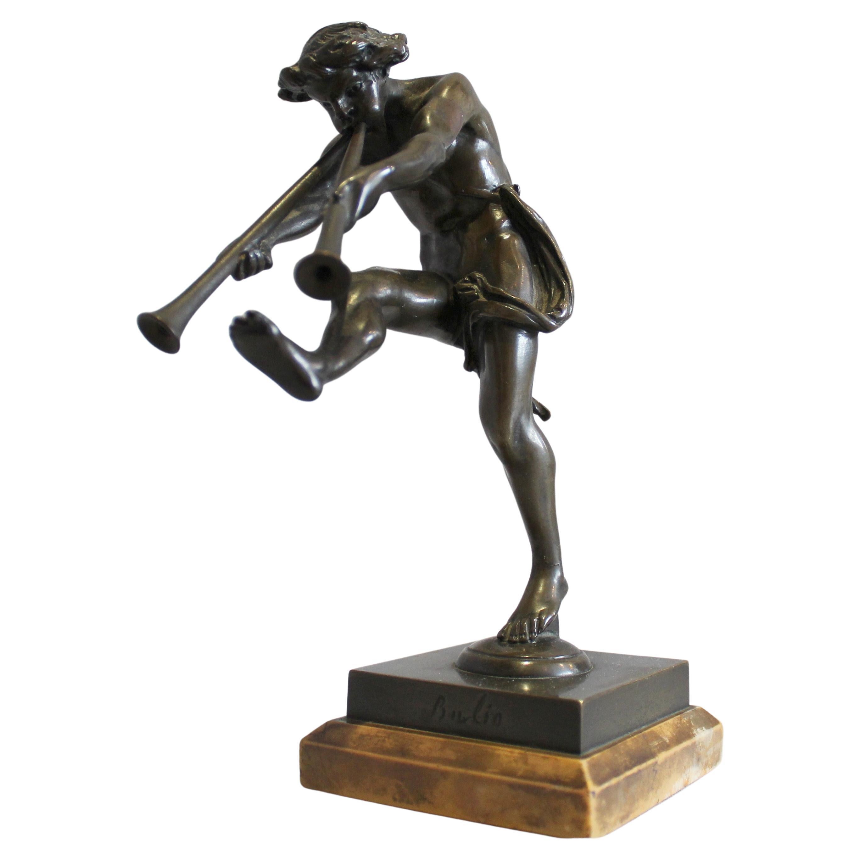 Bronze of a satyr playing pipes on Sienna marble base signed Bulio For Sale