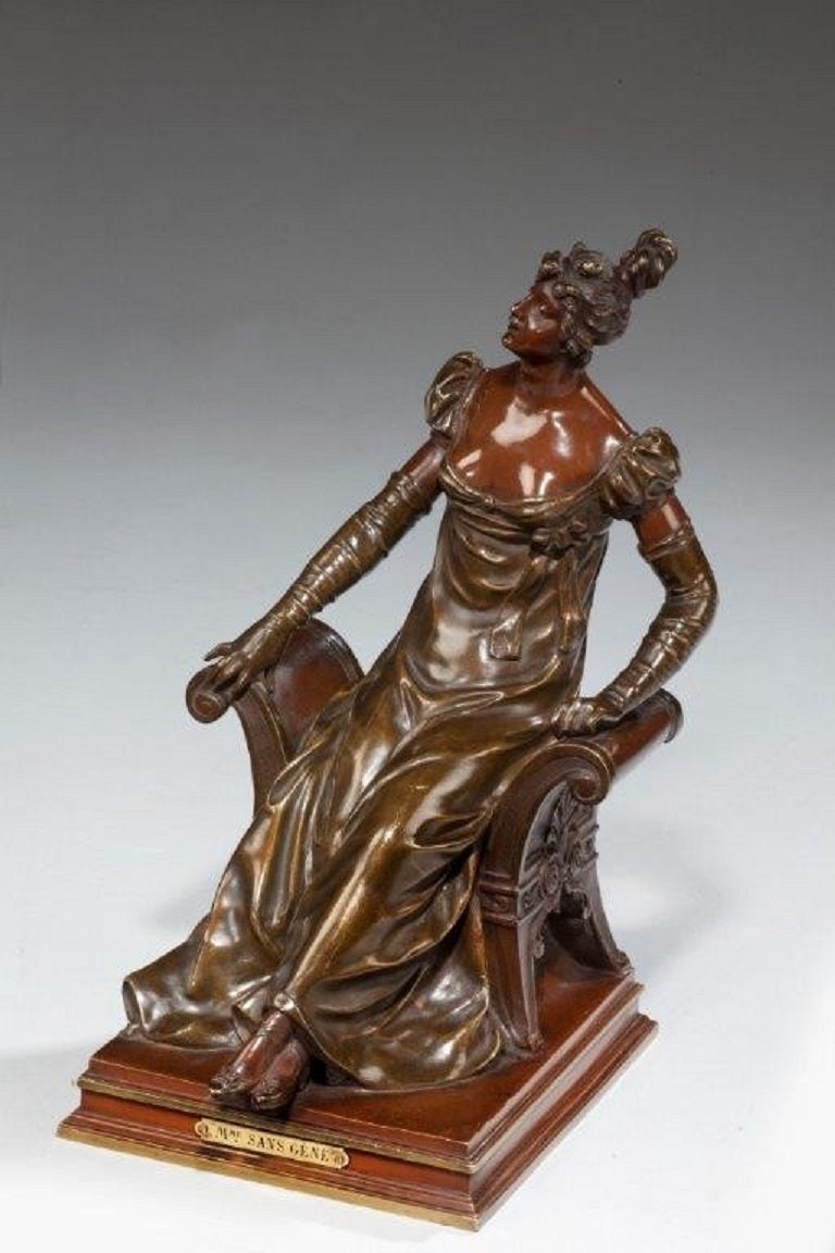 A bronze of a Mme Sans-Gene (Madam Without-a-Care) by Noel-Rouffier, depicted as an Edwardian lady on a window seat.