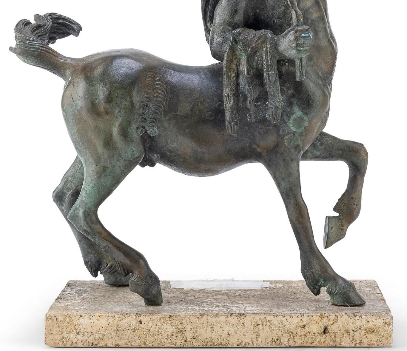 Bronze of the centaur chirone in bronze

Sculpture of the centaur chirone in bronze, 
19th century
with green patina. Rectangular travertine base.
Measurements cm. 52 x 32 x 16.
Very good condition.