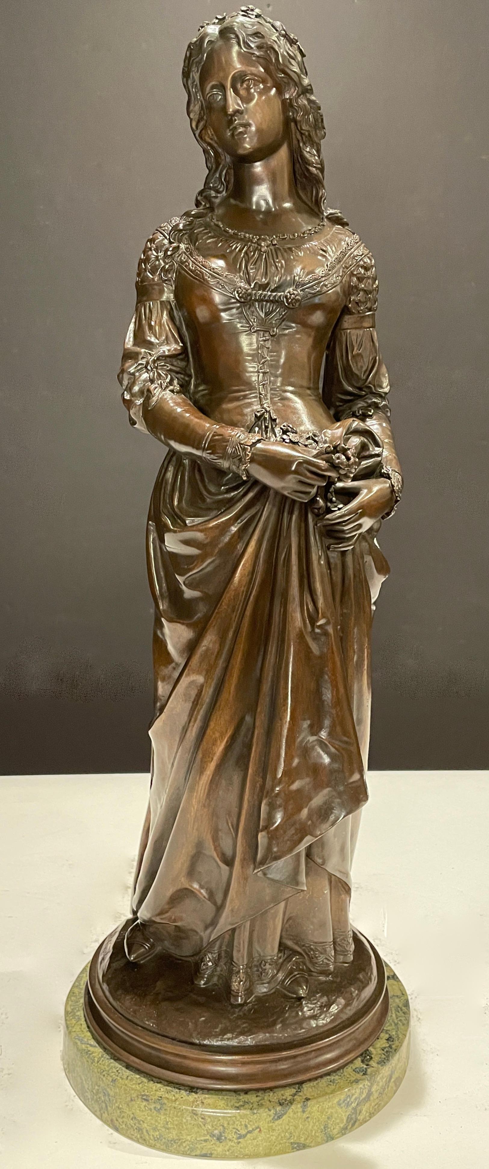 Highly detailed original 19th century bronze sculpture of young lady holding flowers. Dressed in beautiful gown with flowers in her hair. Signed on base, Debut.
Marcel Debut (1865 - 1933), son of sculptor Didier Debut was a French painter and