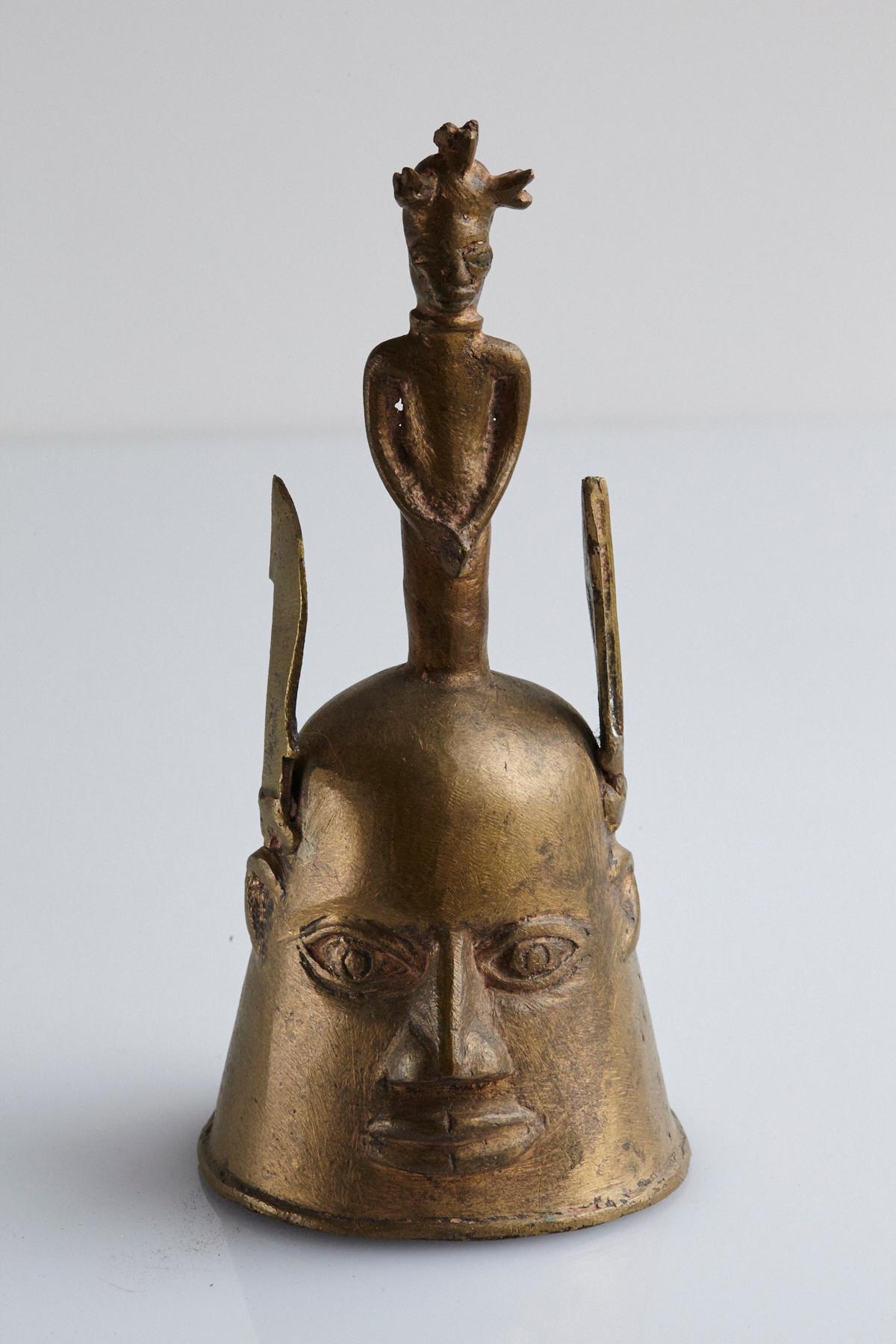 Yoruba Bell surmounted with a handle, made for the Ogboni society was used in rituals, possible to make connections with their ancestors. The Ogboni Society is a fraternal institution indigenous to the Oruba language-speaking polities of Nigeria,