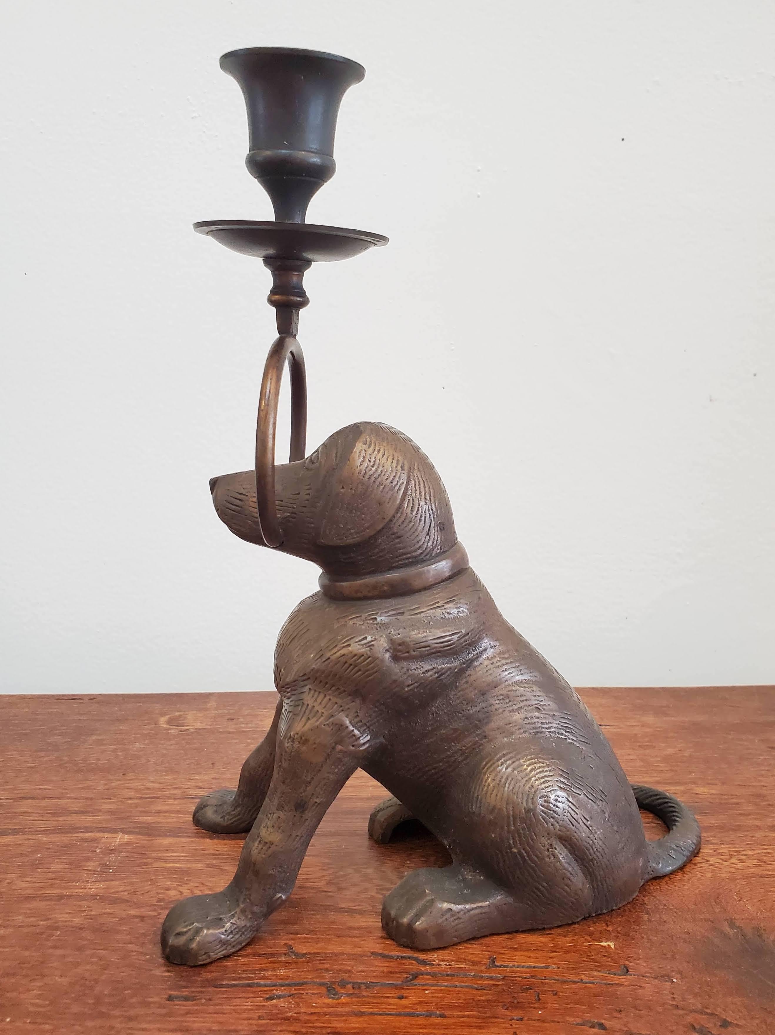 Charming bronze candle holder in the Form of a Labrador. Beautifully detailed body with etchings to depict fur and molded curves of muscles. Holds one taper candle. 
Measures: 9” H, 6.5” W.


 