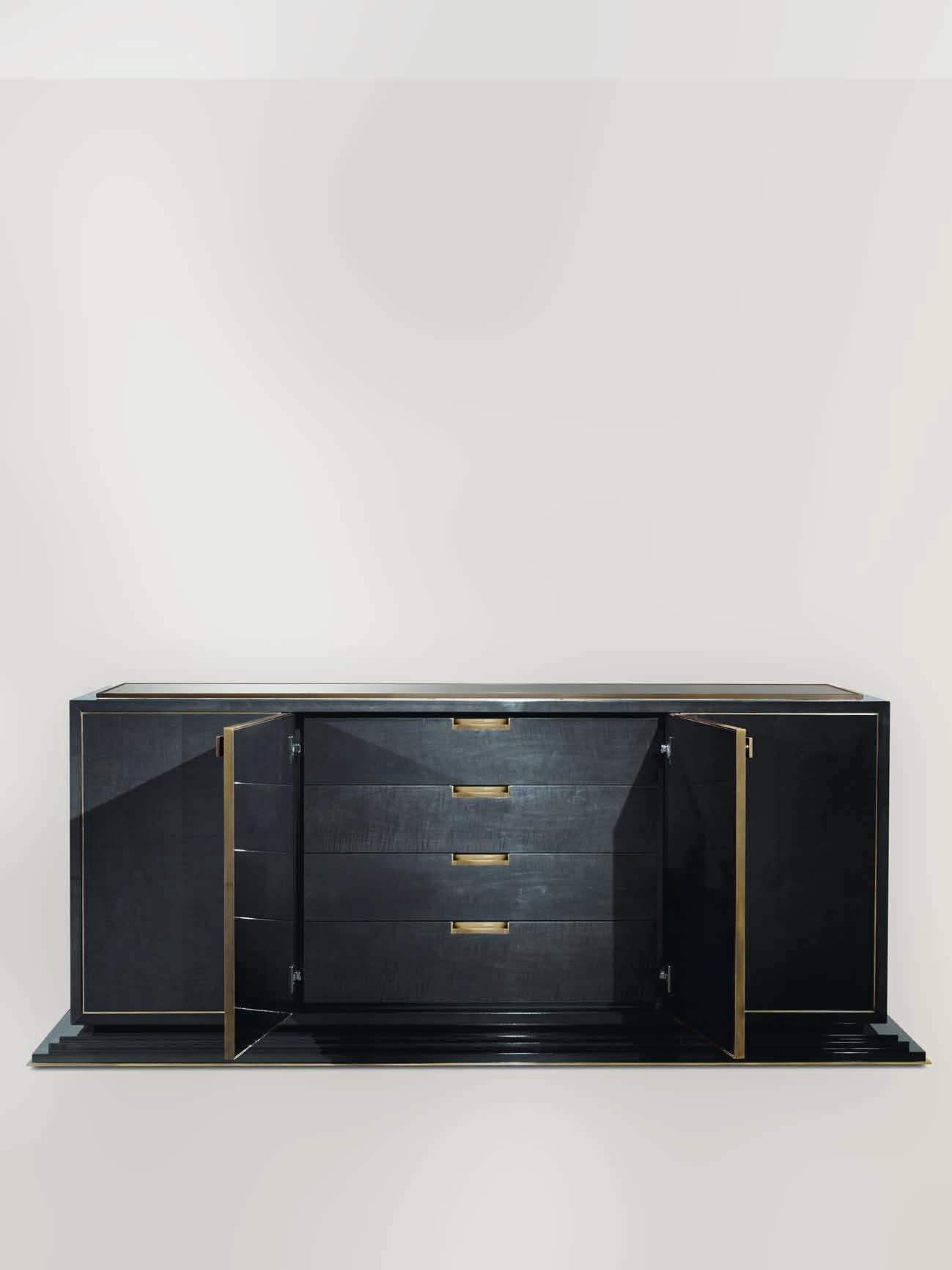 Figured Sycamore stained dark grey in high gloss finish, bronze trimming detail all around the top and base. Bronze inlay on the sides. Top covered in dark grey parchment in high gloss finish, n. 4 doors with bronze detail all around the doors, soft