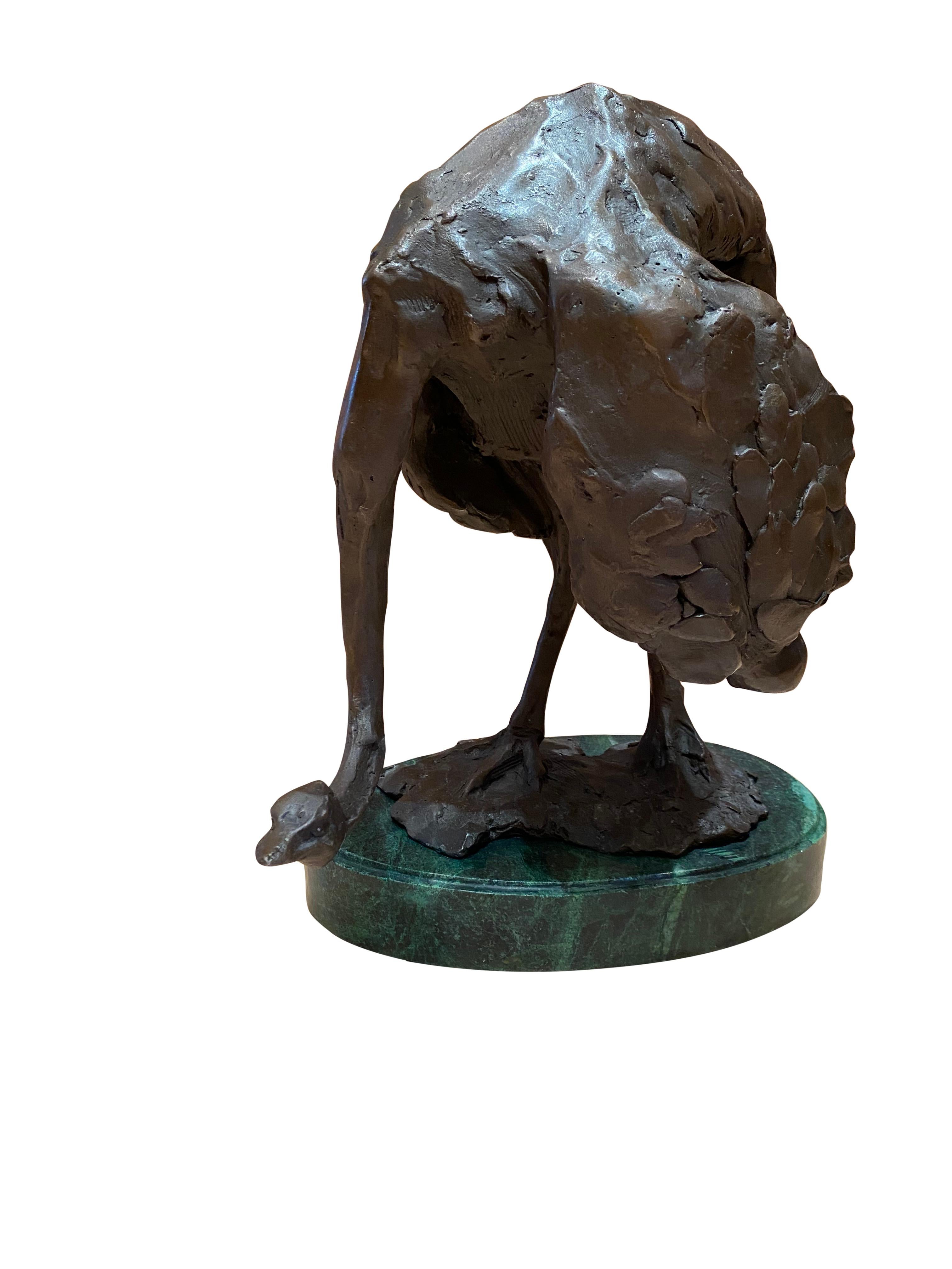 A fine quality bronze ostrich sculpture, 20th century. Stands on a verdigri proportionate oval marble base. This piece is offered with excellent detail and sharp points of view. The artist has paid great attention to detail.