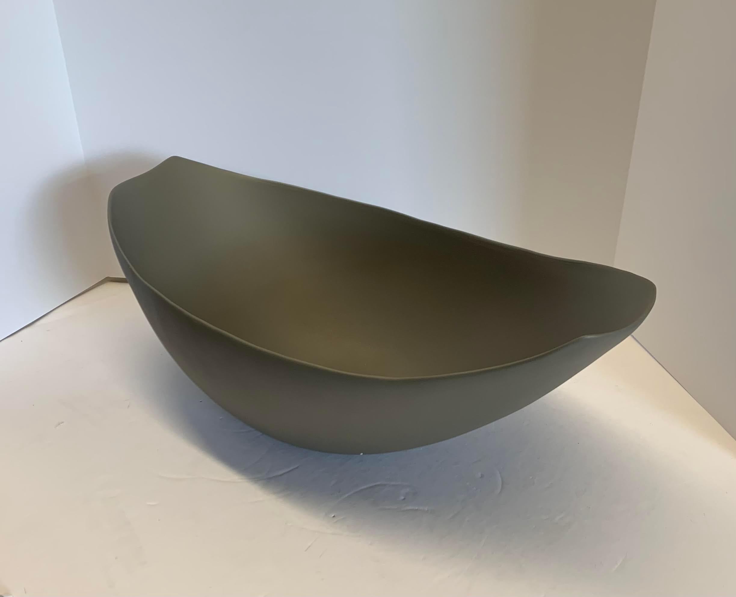 Contemporary Italian oval shaped fine ceramic bowl in bronze.

 
 