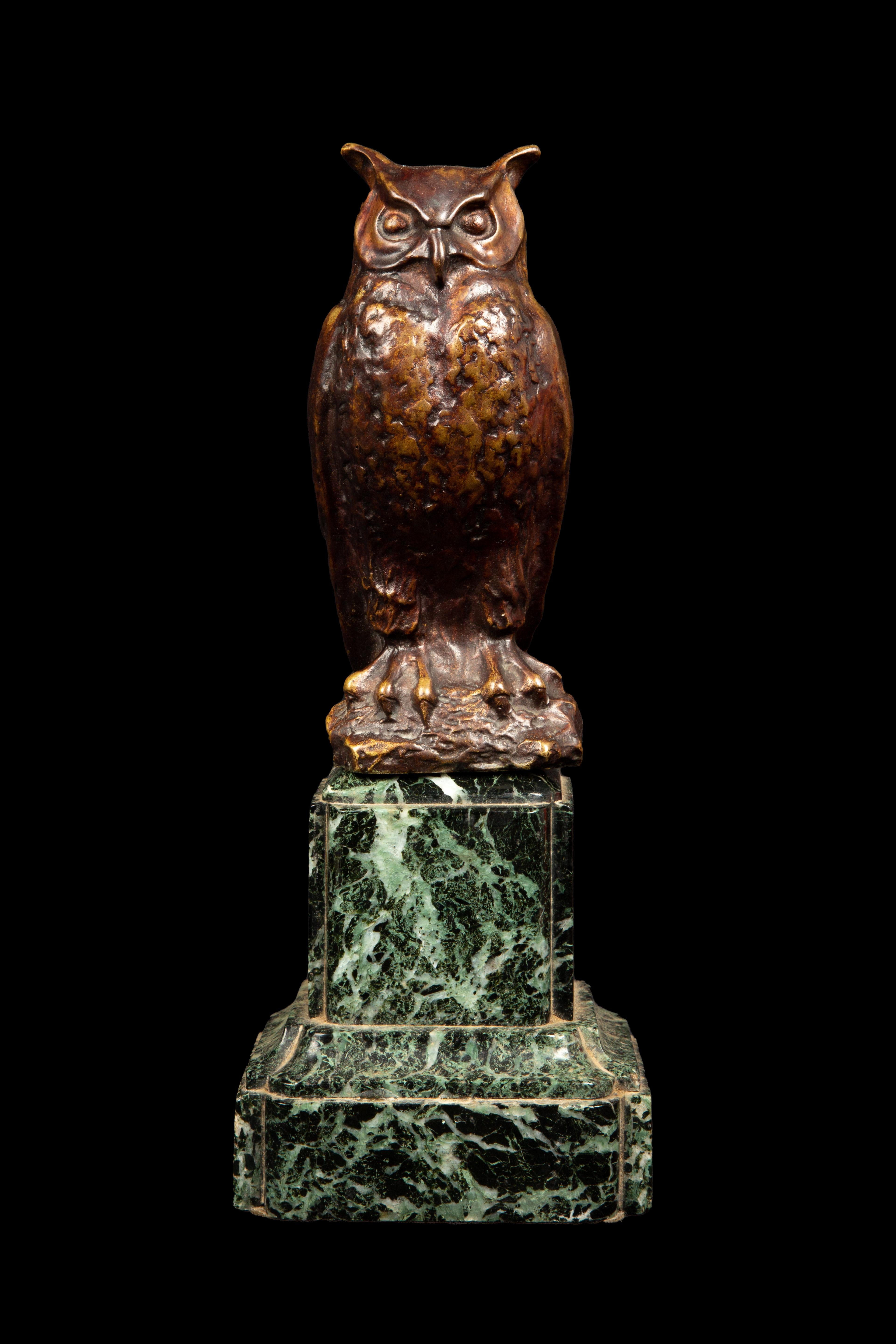 Max Le Verrier (1891 - 1973) was a famous French artist known for creating stunning bronze sculptures. One of his remarkable pieces is this owl sculpture made of bronze with a brown patina, placed on a green marble base. It stands at 11 inches tall