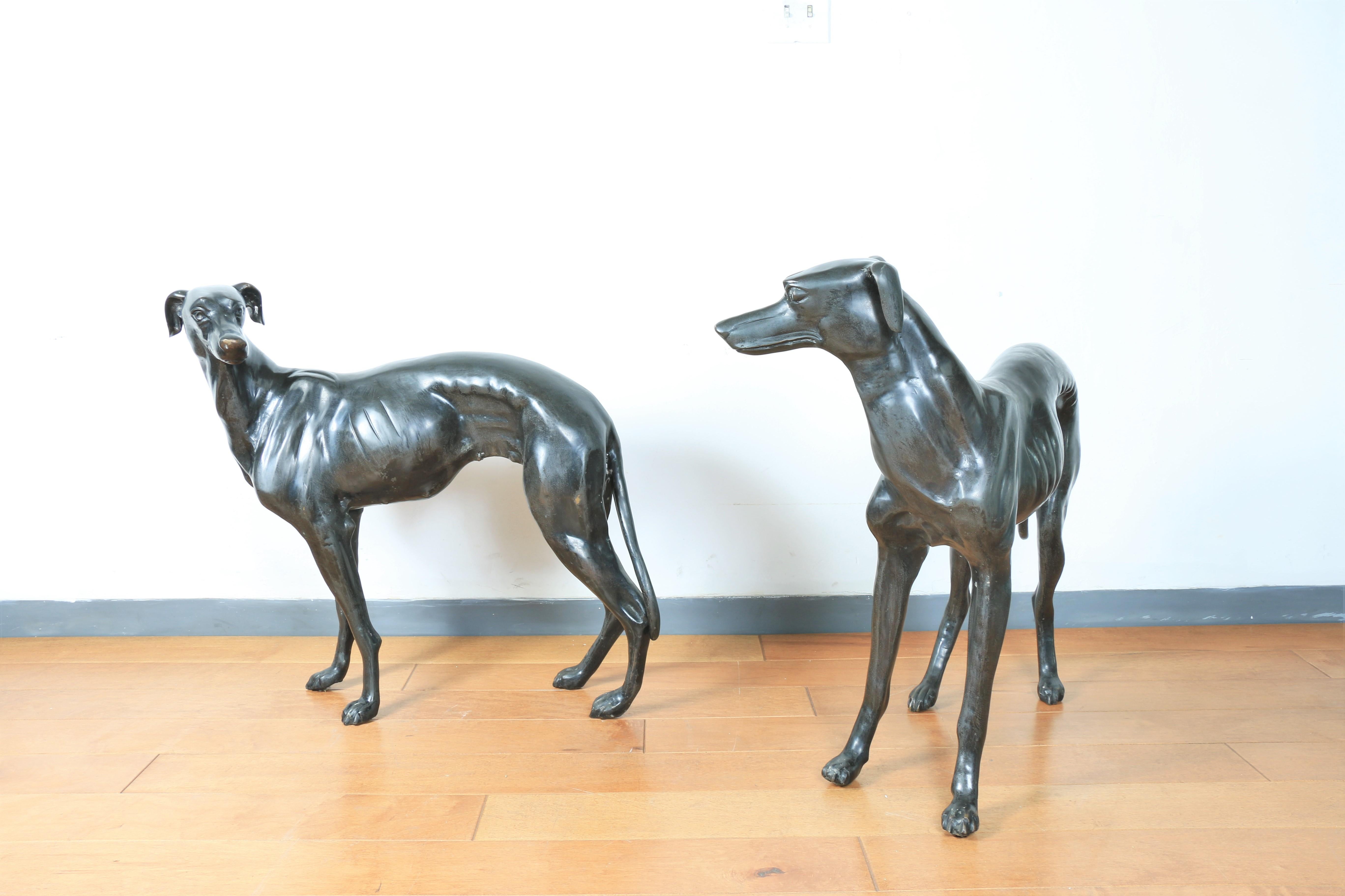 Gorgeous pair of elegant bronze greyhound dog statues in excellent condition. No damages or broken parts. Both dogs are great accent pieces for any home.