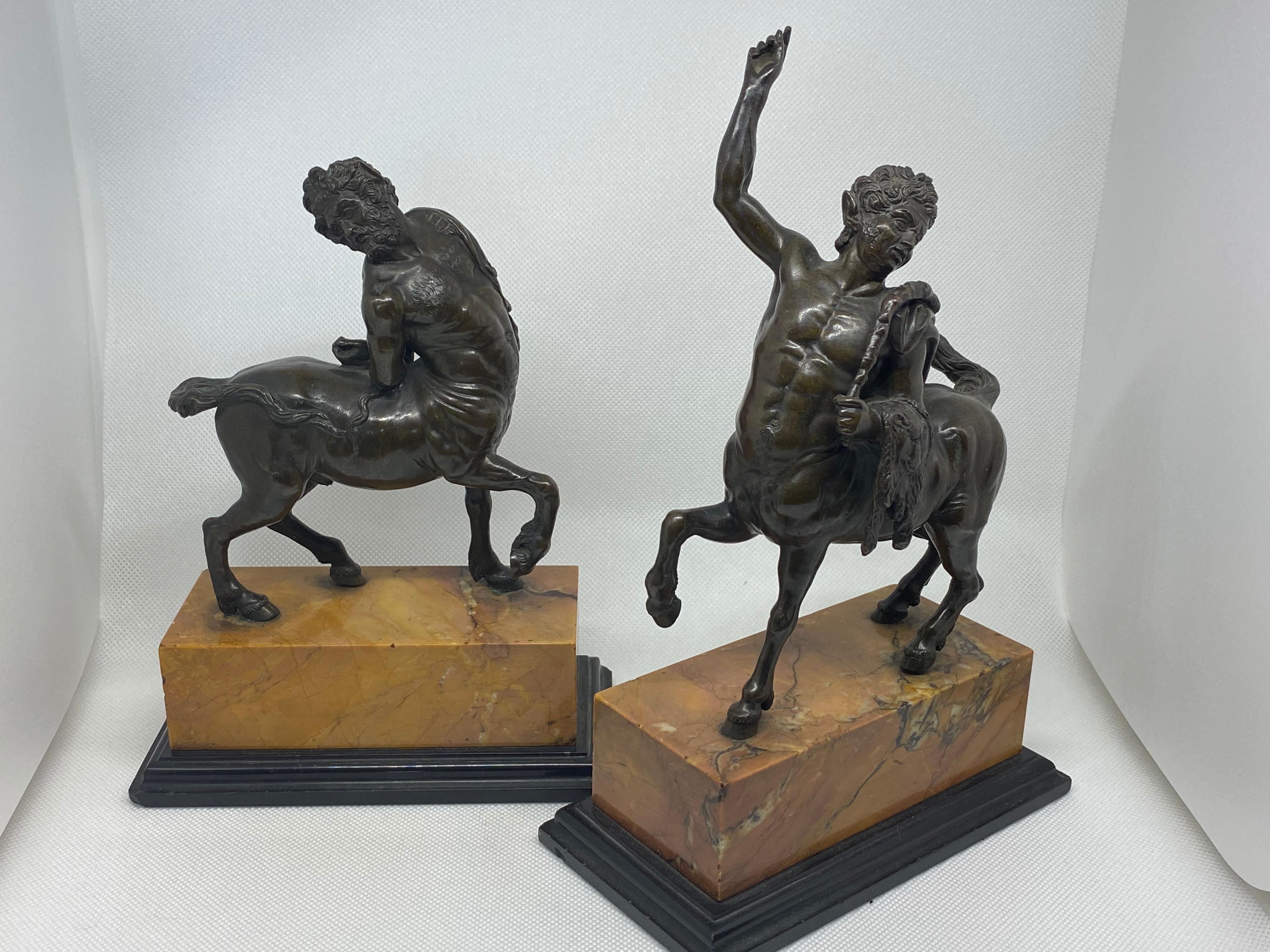 Very finely cast bronze copies of the Furietti Centaurs, one depicting a young centaur and the other depicting and old centaur. They are each mounted on a marble base and are unsigned. These bronzes are 19th century copies of the two Roman (or