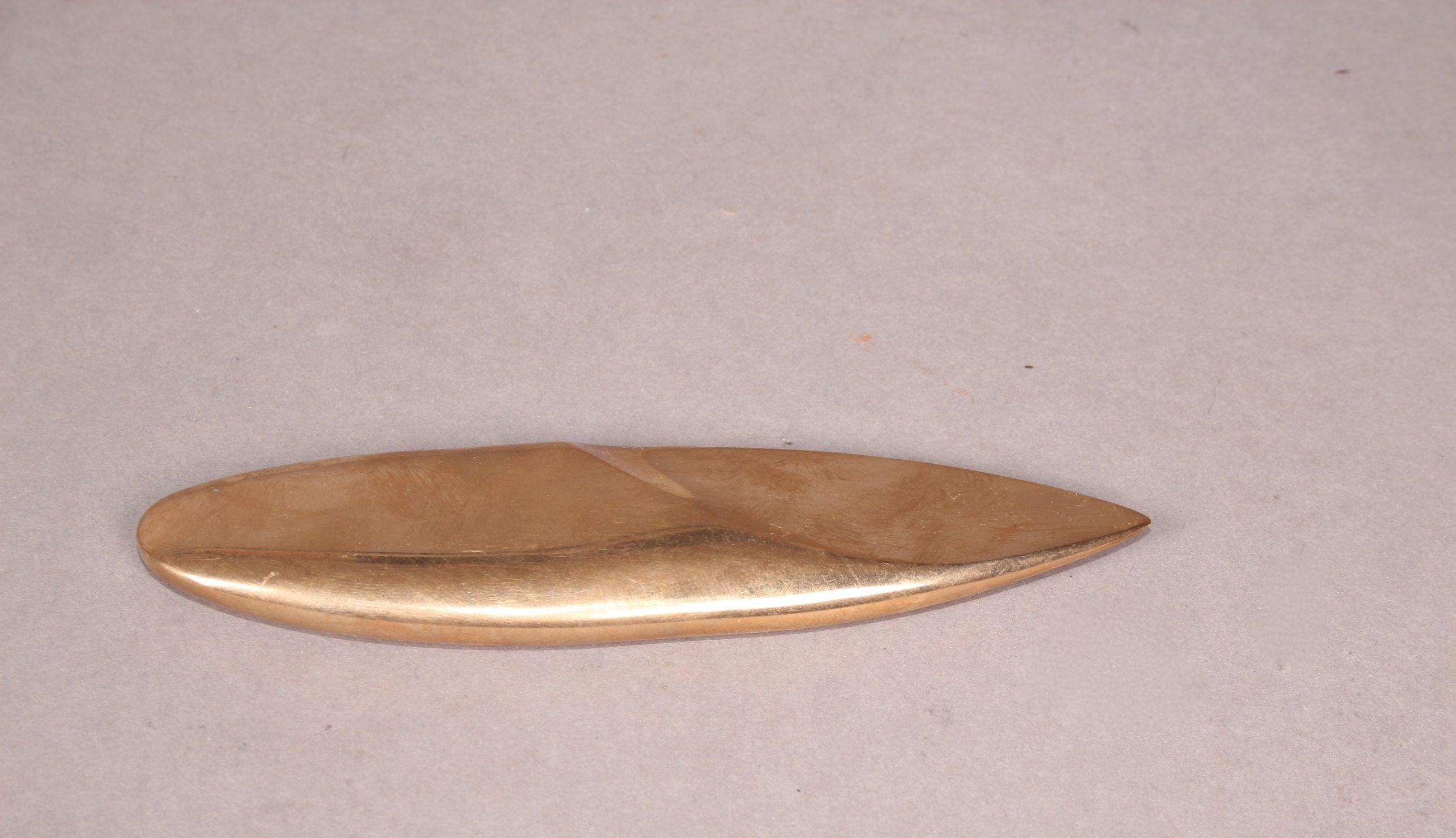 Bronze paper cutter.