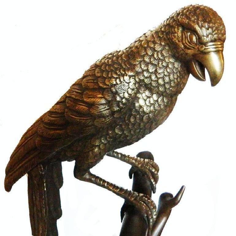 A bronze parrot on perch, 2 patina bronze. This sculpture was used in 