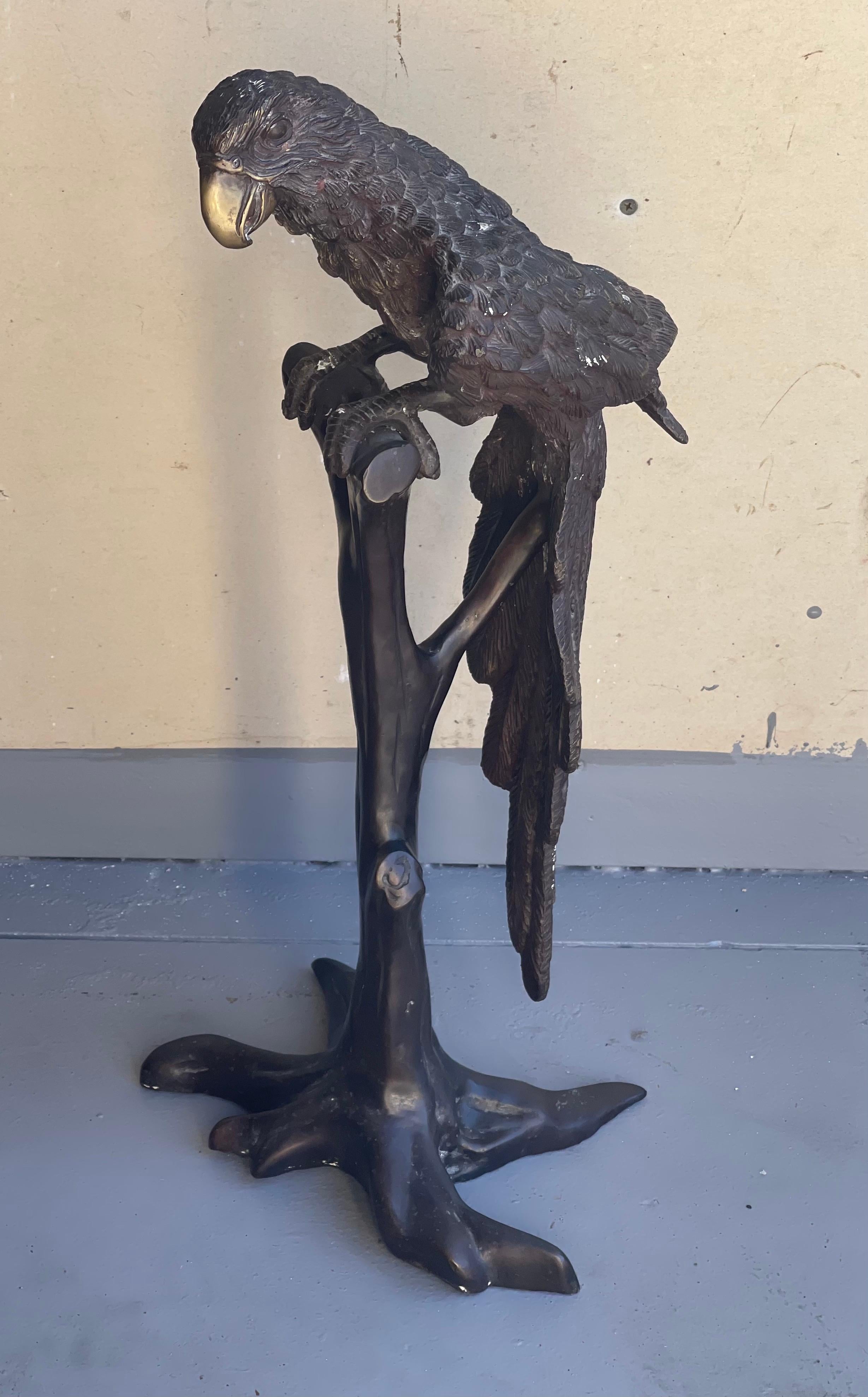 Life-size bronze parrot on tree branch sculpture signed by Segal, circa 1970s. The piece is in good vintage condition with a beautiful patina and measures 10.5