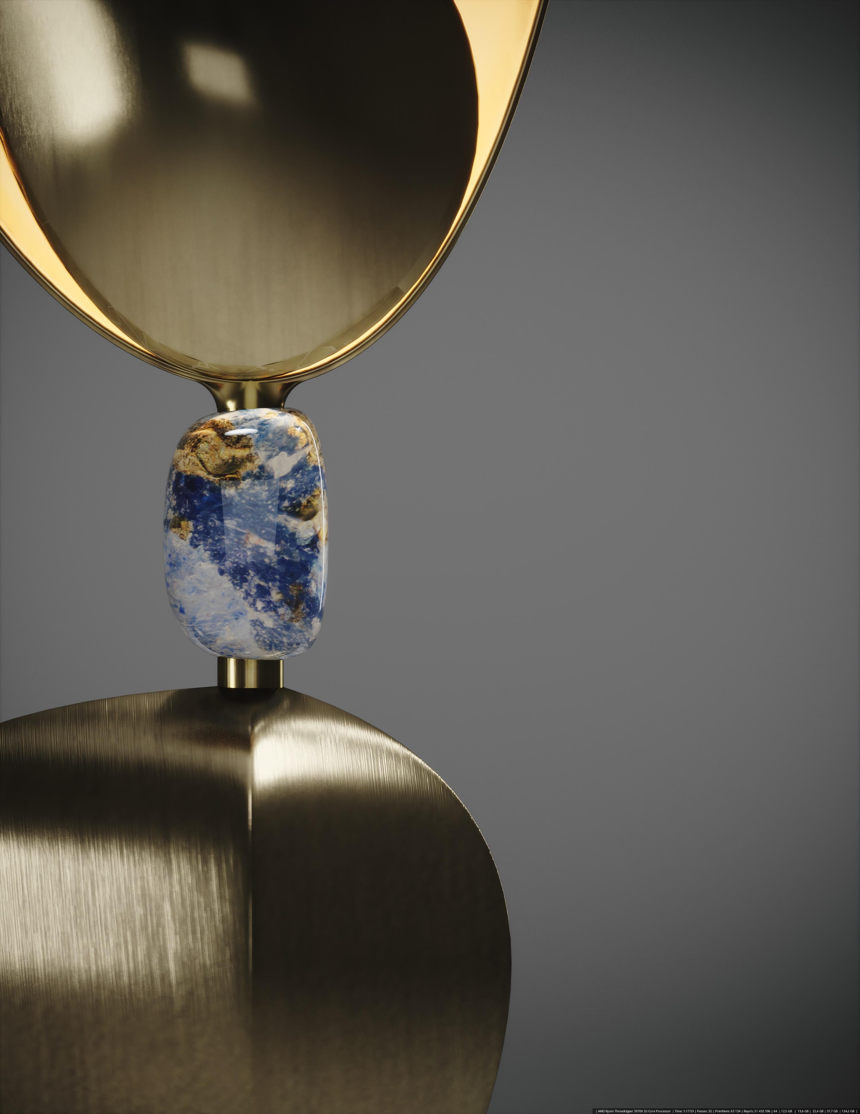 The Cosmo Bird table lamp by Kifu Paris is a whimsical and sculptural piece, inlaid in bronze-patina brass with a beautiful lapis lazuli piece in the center. The amorphous shapes are an abstract and poetic reinterpretation of a bird flying in a