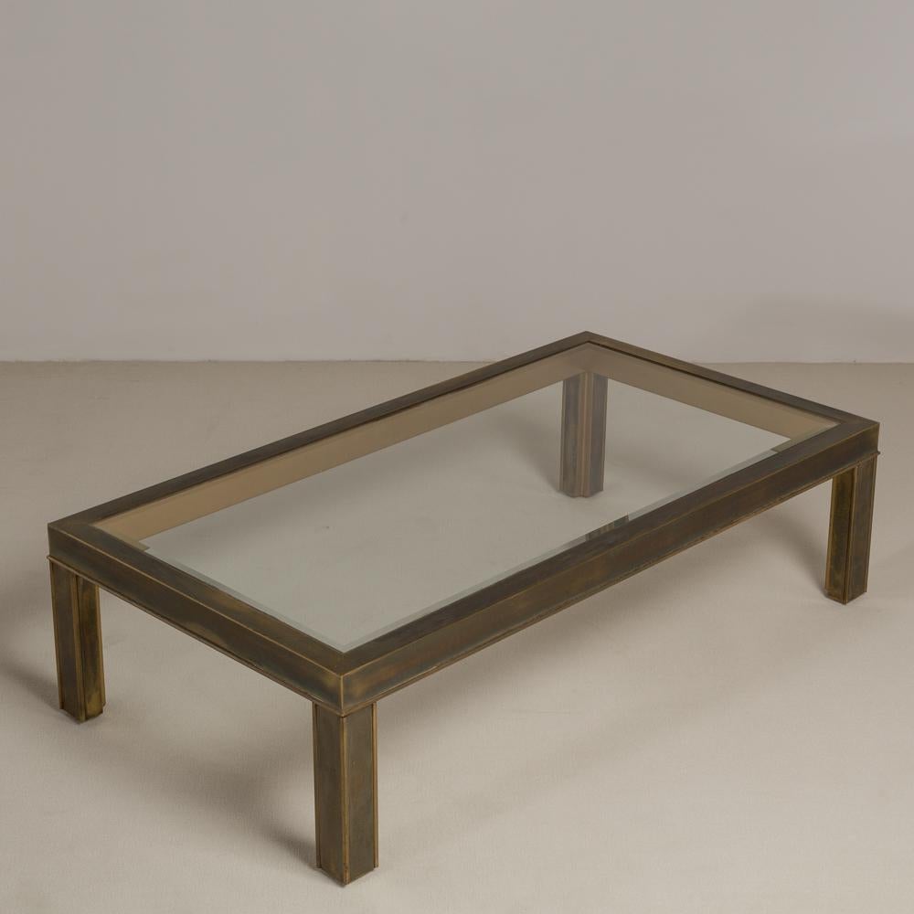Bronze patinated brass framed rectangular coffee table with inset glass top USA, 1970s.