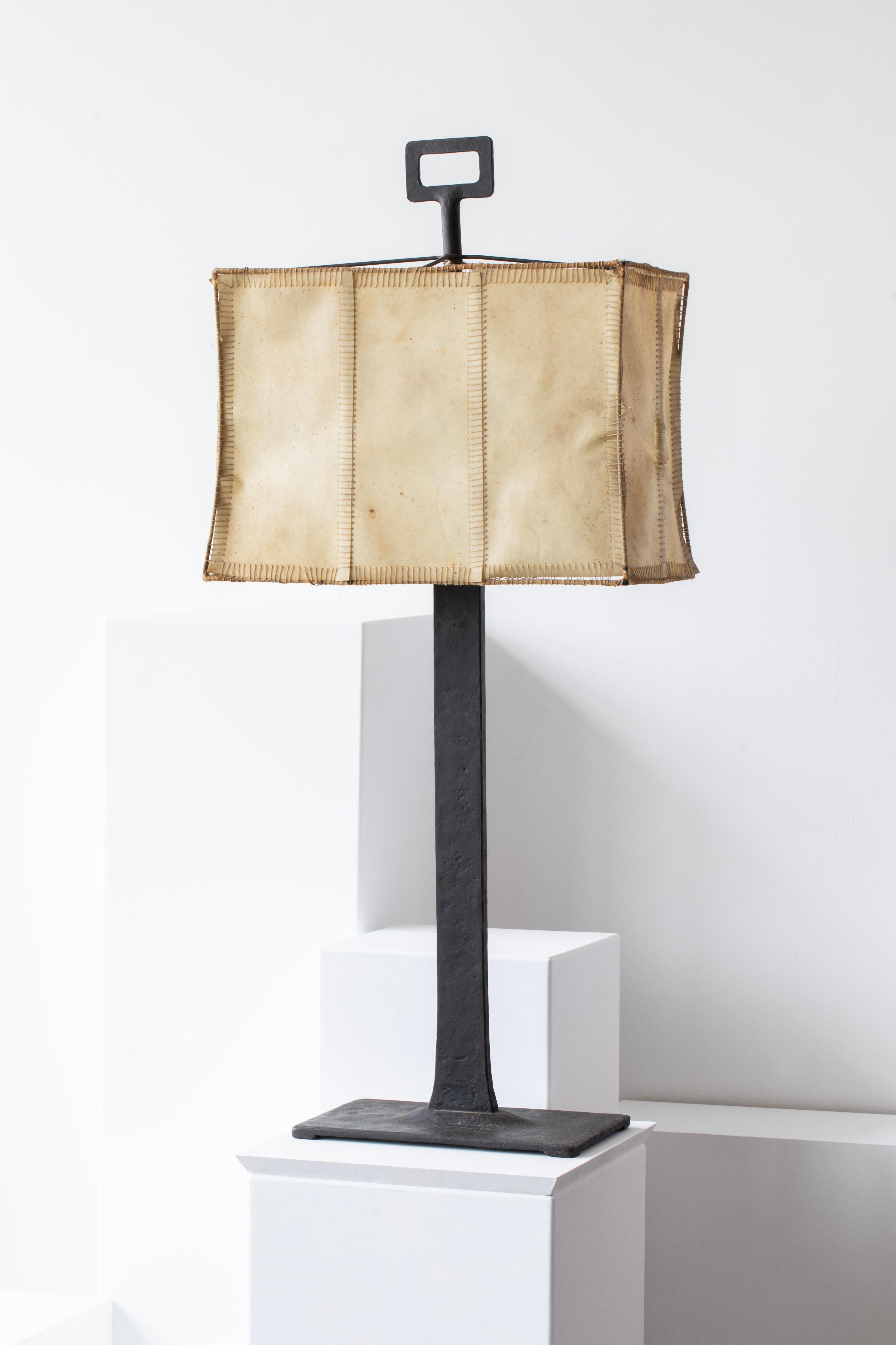 Beautiful bronze-patinated iron table lamp attributed to Marc du Plantier with hand-stitched parchment shade.
Please review photos for the condition of the parchment lampshade.

Marc's Bio via A.I. :

Marc du Plantier (1901–1975) was a highly