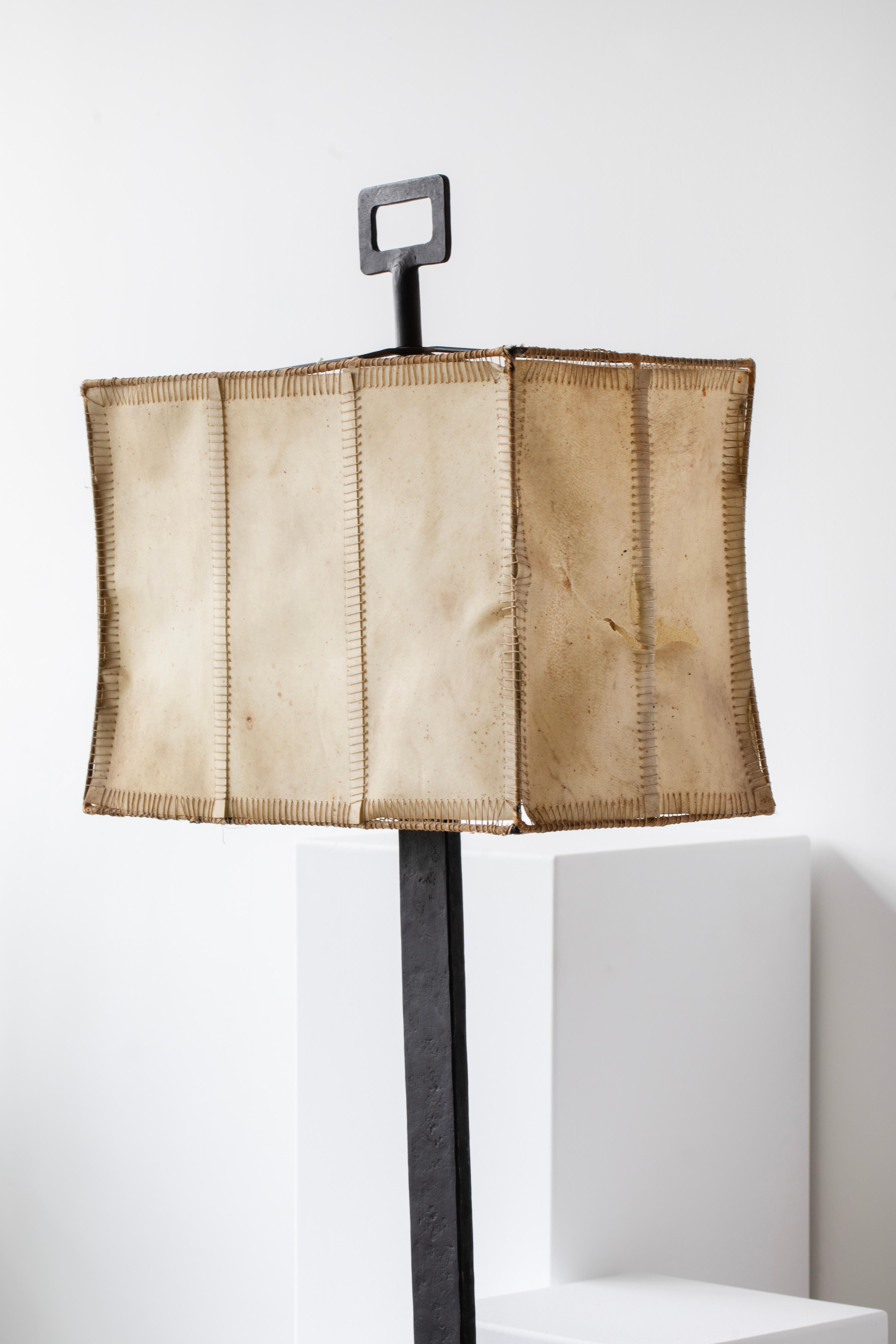 Mid-20th Century Bronze-Patinated Iron and Parchment Table Lamp Attributed to Marc du Plantier For Sale
