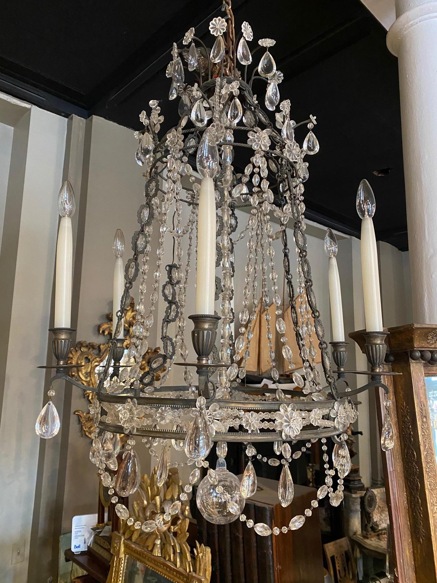 Bronze patinated six arm chandelier by Maison Baguès in clear and amethyst crystal.