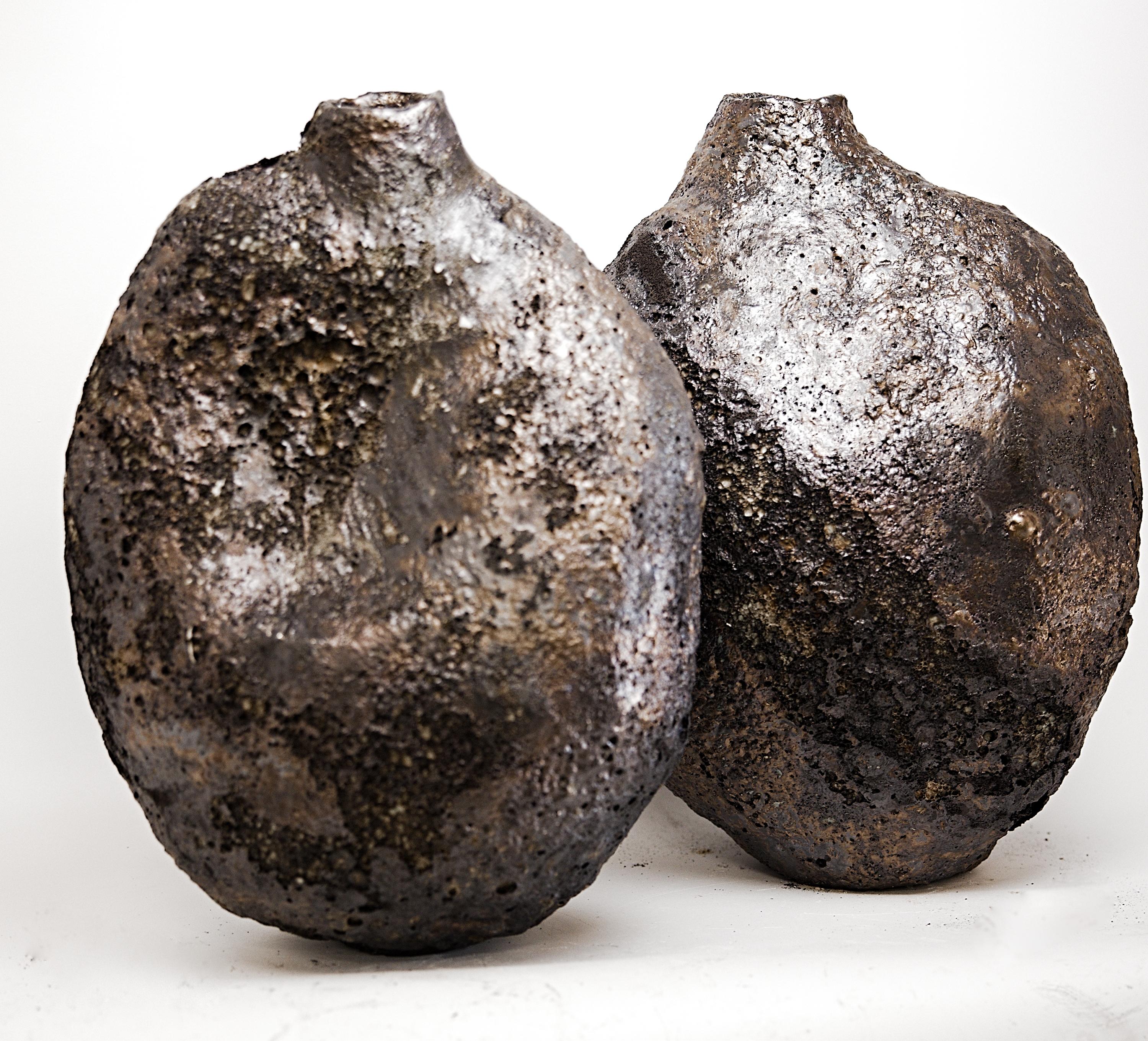 Experience the exquisite artistry of the Fubuki Organic Bottle Vases  at The Shine Studios, where each piece evokes the feeling of winter snow storms in the villages of Japan. This stunning vase showcases layers of white and cream with textured and