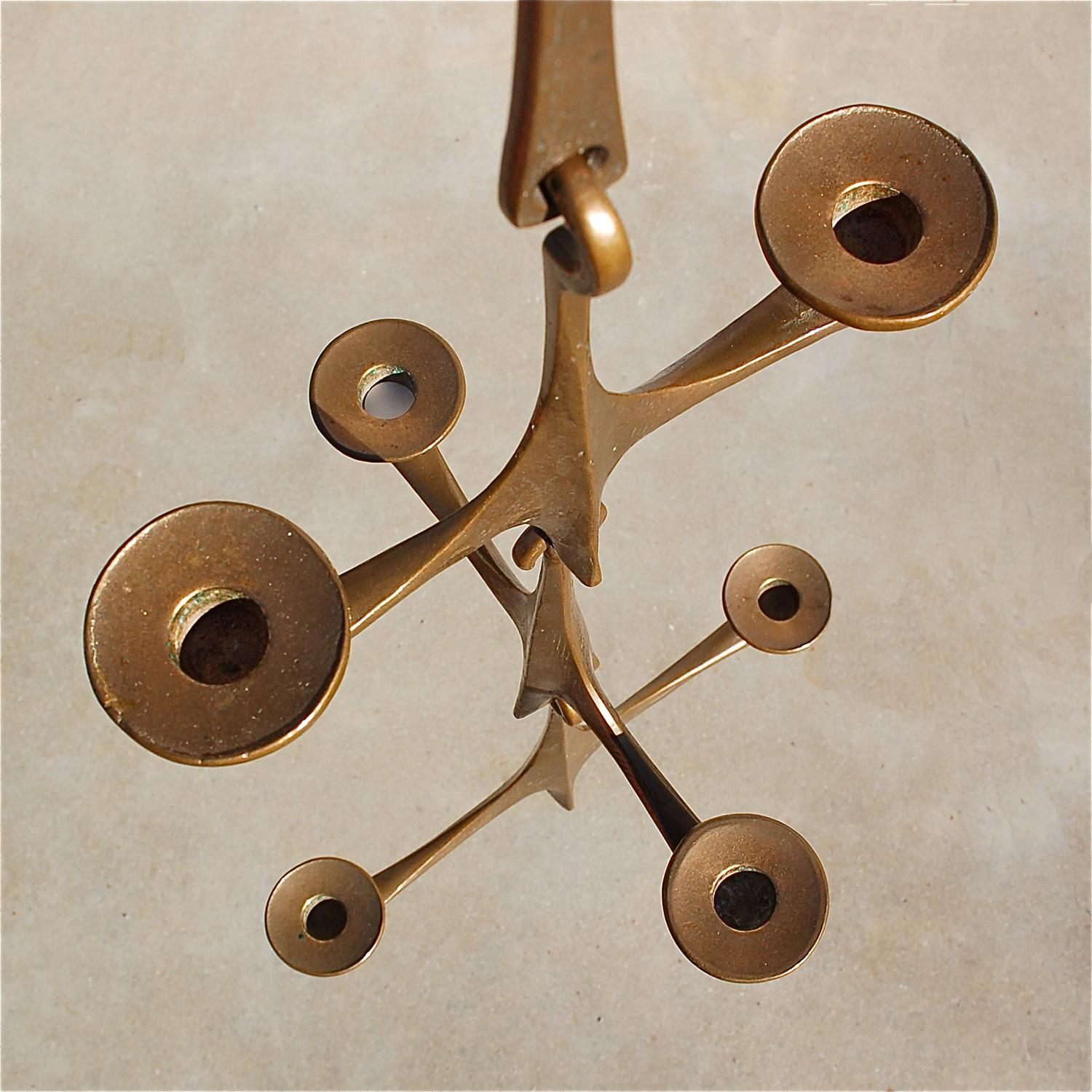 Heavy, solid bronze pendant candleholder or chandelier by Harjes, a small family firm that has been producing handmade quality bronze decorative items since 1912. The bronze has wonderful patina that has built up over the years, giving a lovely