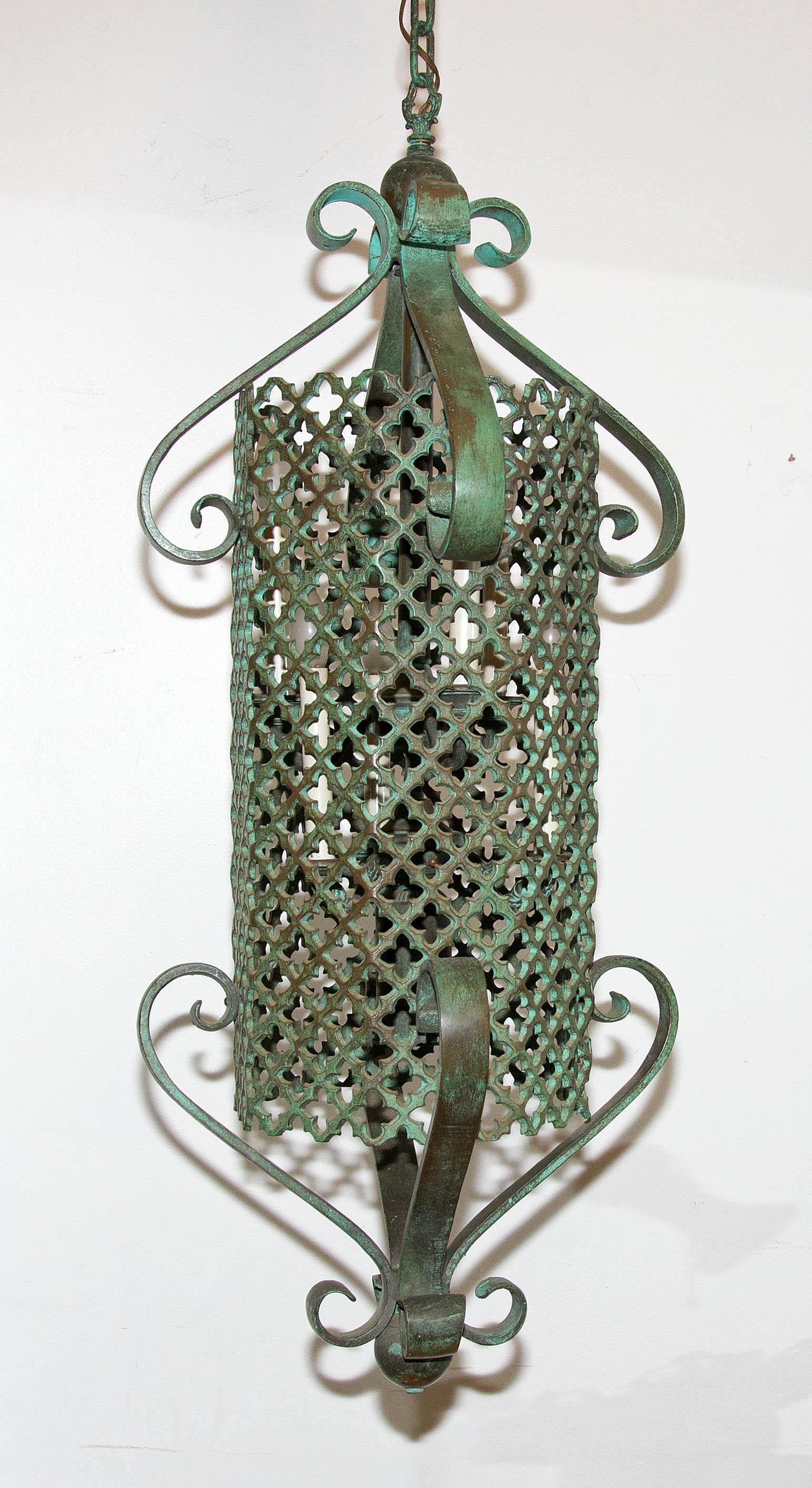 High quality bronze pendant light. Verdigris patina. Interior with six candle lights and one down light. Six feet of matching bronze chain, early 20th century.