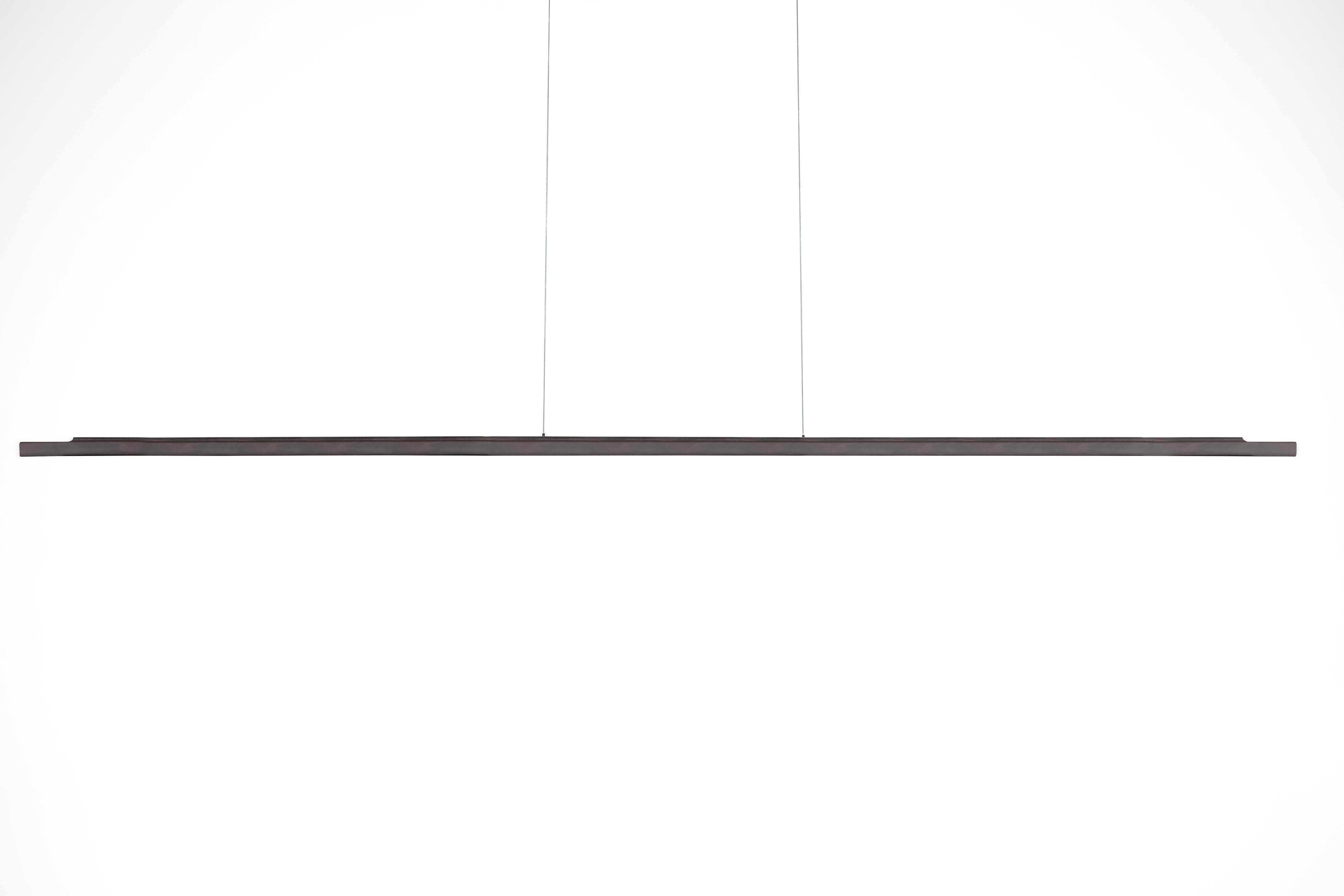 Bronze Philo Pendant Lamp by Eichkorn
Dimensions: W 180 x D 3 x H 2.5 cm
Materials: cast & patinated bronze.

Philo is a luminaire of quiet elegance. Cast from solid bronze with a brown patina, it appears to float weightlessly in the space –
