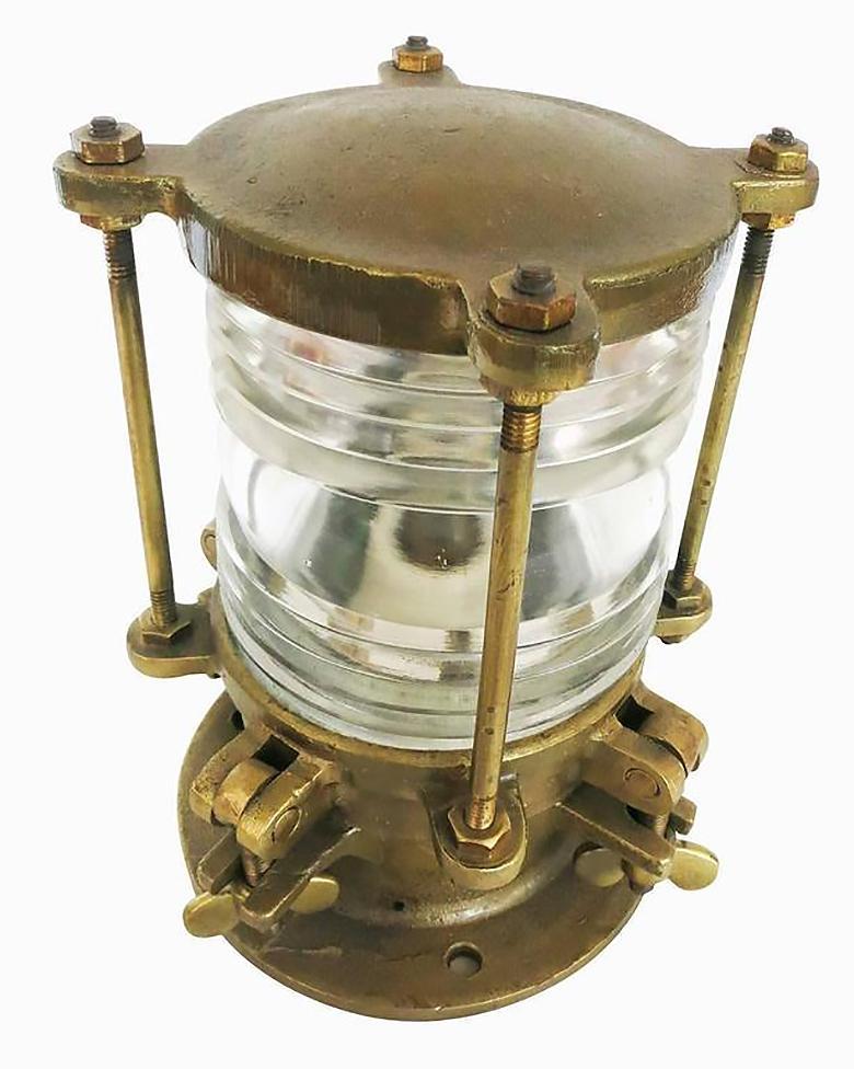 Solid bronze piling dock light with 360 degrees Fresnel lens. The glass lens is stepped to provide a wide array of light with a low amount of power. The body is made of solid bronze bringing the light to a 20-pound weight. 15-40 watts incandescent