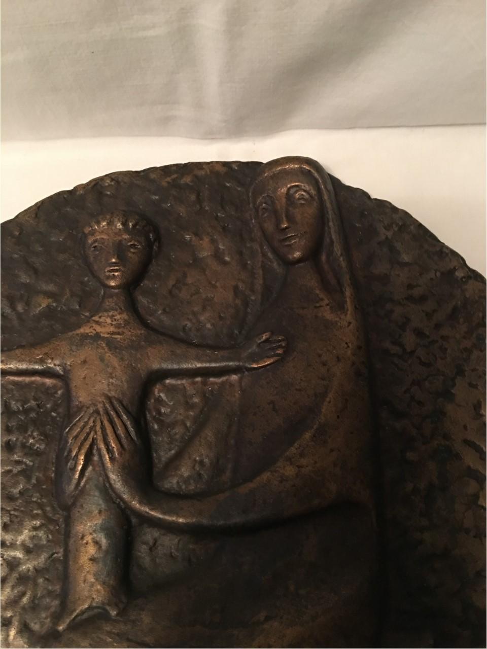 Inscribed with the designer initials of HB this lovely bronze plaque of virgin Mary with the Christ Child from Germany midcentury.