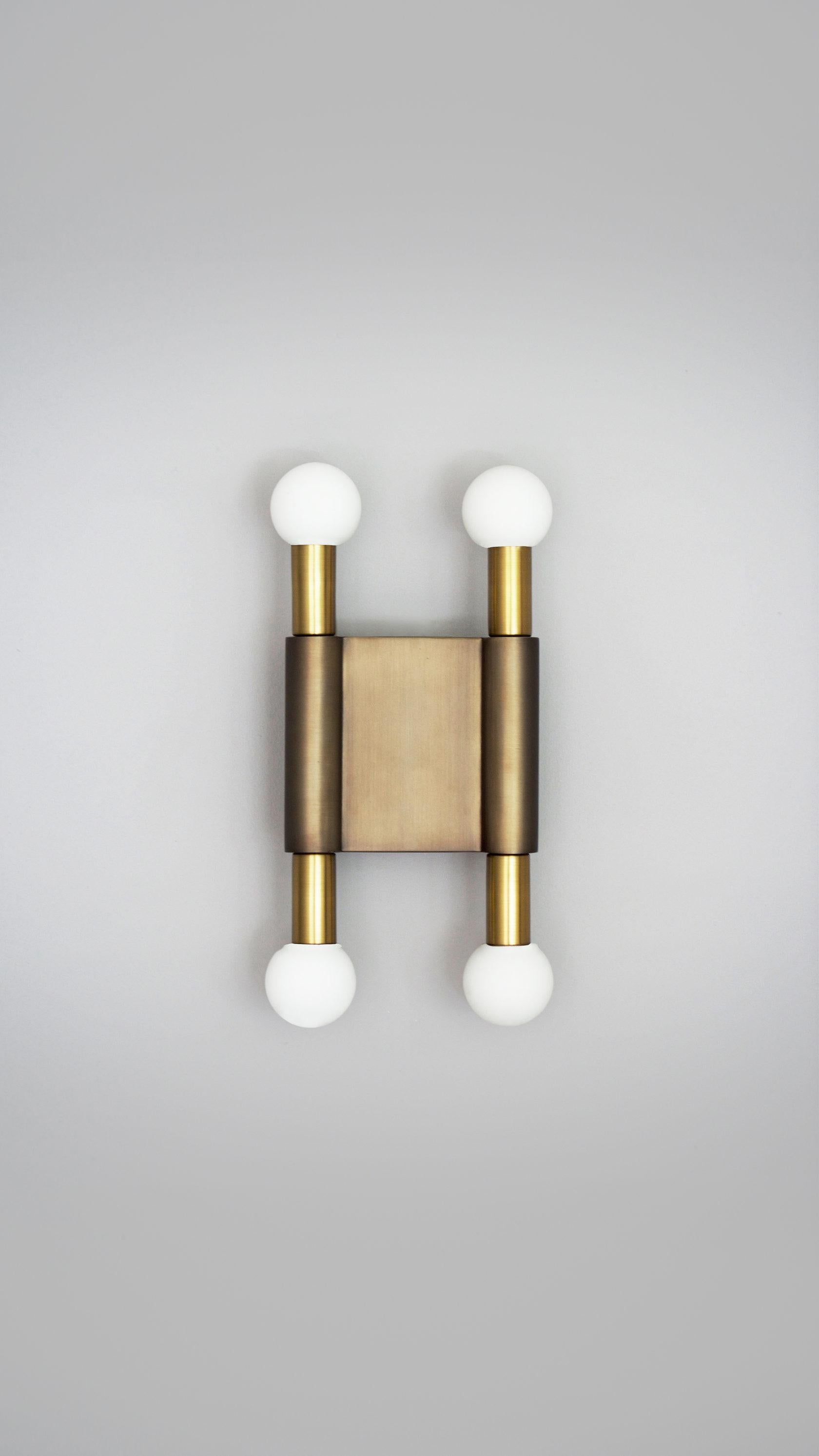 Bronze Pole and Circle II Wall Light by Square in Circle
Dimensions: W 16 x H 34 x D 7 cm
Materials: Dark bronze finish, brushed brass, opaque white glass globes

A minimal two-tone bronze wall light with opaque glass globes projecting from beneath