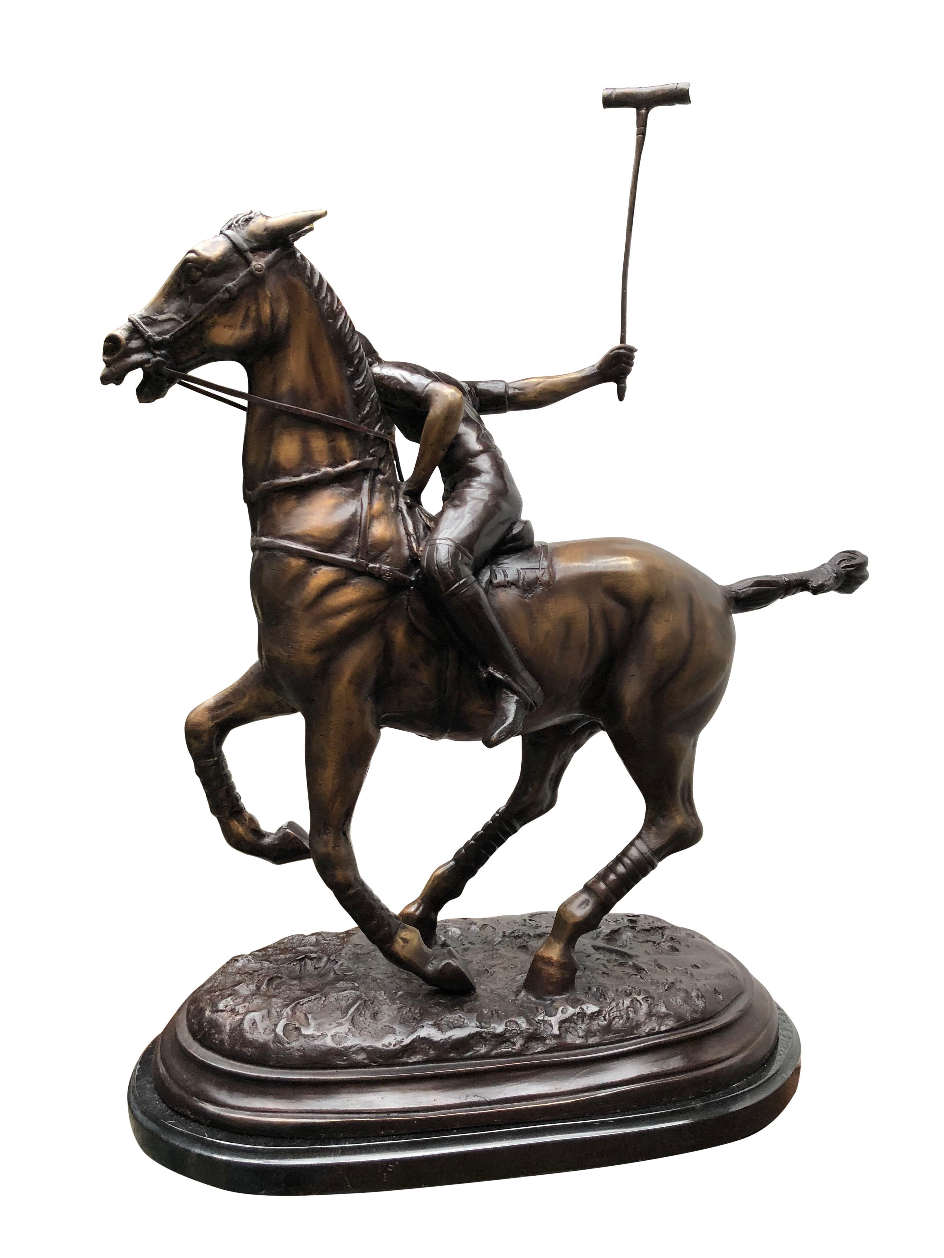 A stunning English bronze casting of a polo player in full swing. Artist has really captured the energy and athleticism of the scene with great skill. Patina to the bronze is superb with various brown hues. Piece sits on a black marble base which is
