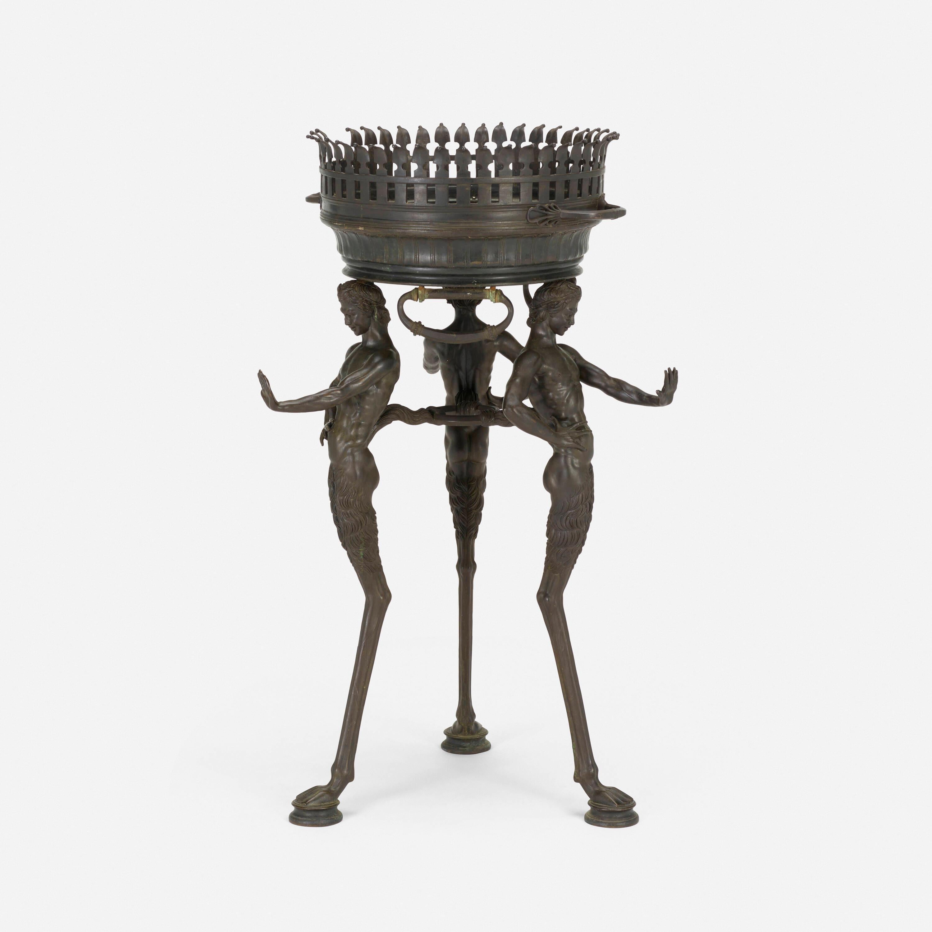 Bronze Pompeian Athénienne-Jardinière attributed to Sabatino De Angelis & Fils
The present work was inspired by a Pompeian brazier that was buried in 78 A.D. and excavated later. as three satyrs holding aloft a handled dish with pierced gallery The
