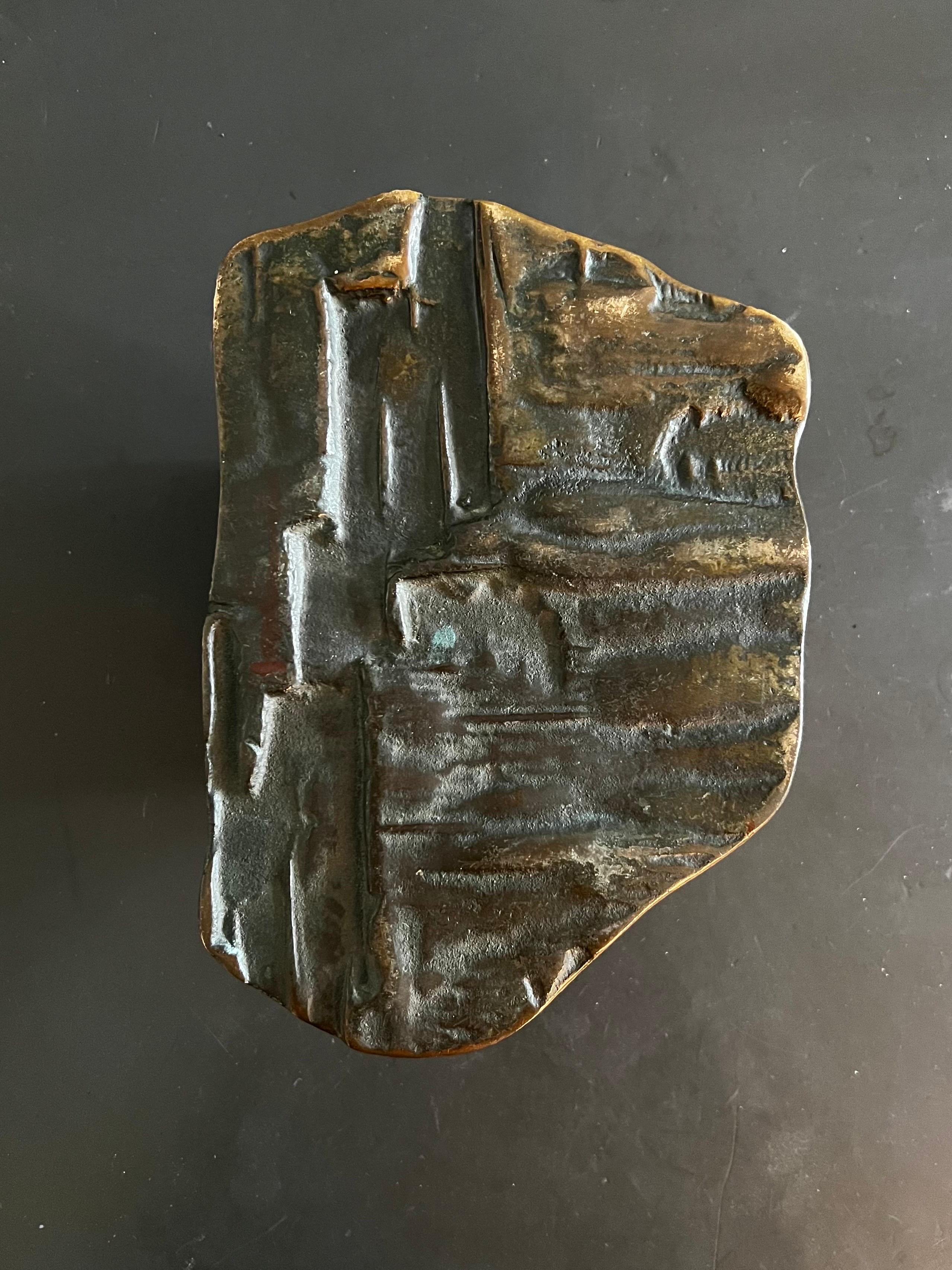 A large bronze door handle - push or pull design - with raised abstract pattern. Mid-to-late 20th century, European.

This is a heavy piece, made of cast bronze; e have not cleaned or polished this piece and it is offered as found. The metal has