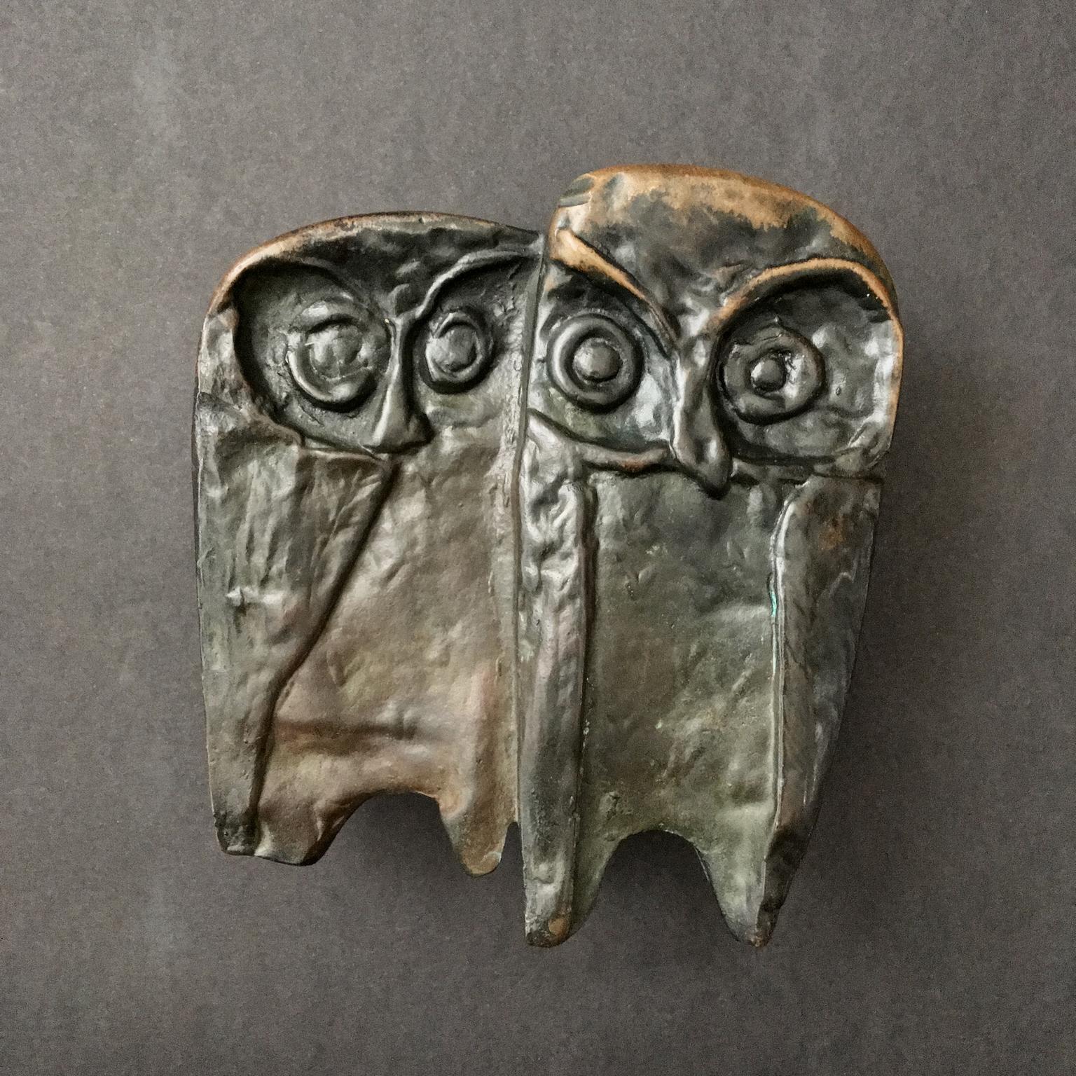 A bronze push or pull door handle, with owl design, mid-late 20th century, European.

This is a heavy piece, made of cast bronze with an owl design. We have not cleaned or polished this piece and it is offered as found. The metal has very nice