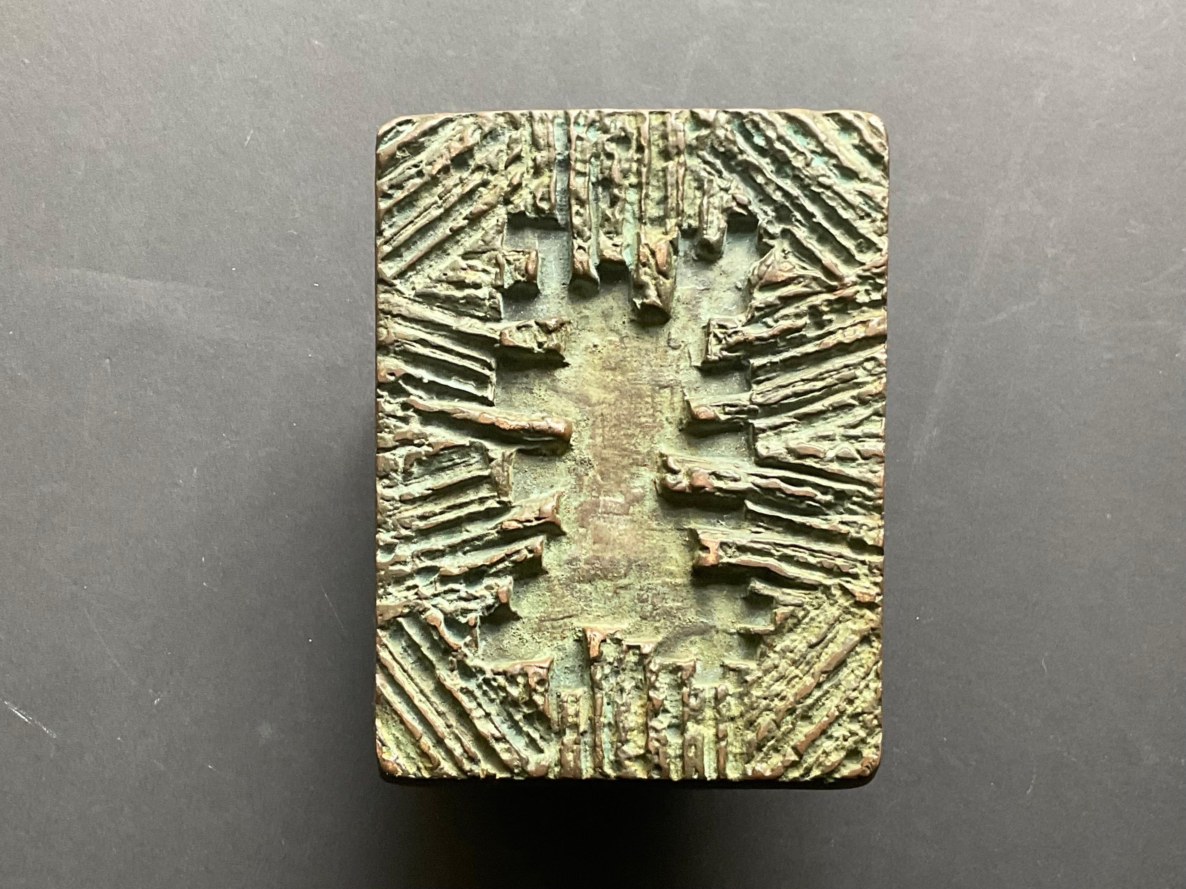 A sculptural bronze push or pull door handle with abstract relief. Second half 20th century (probably 1970s), found in Germany.

A heavy rectangular piece, made of cast metal, with a heavy green/brown patina. Overall good vintage condition with