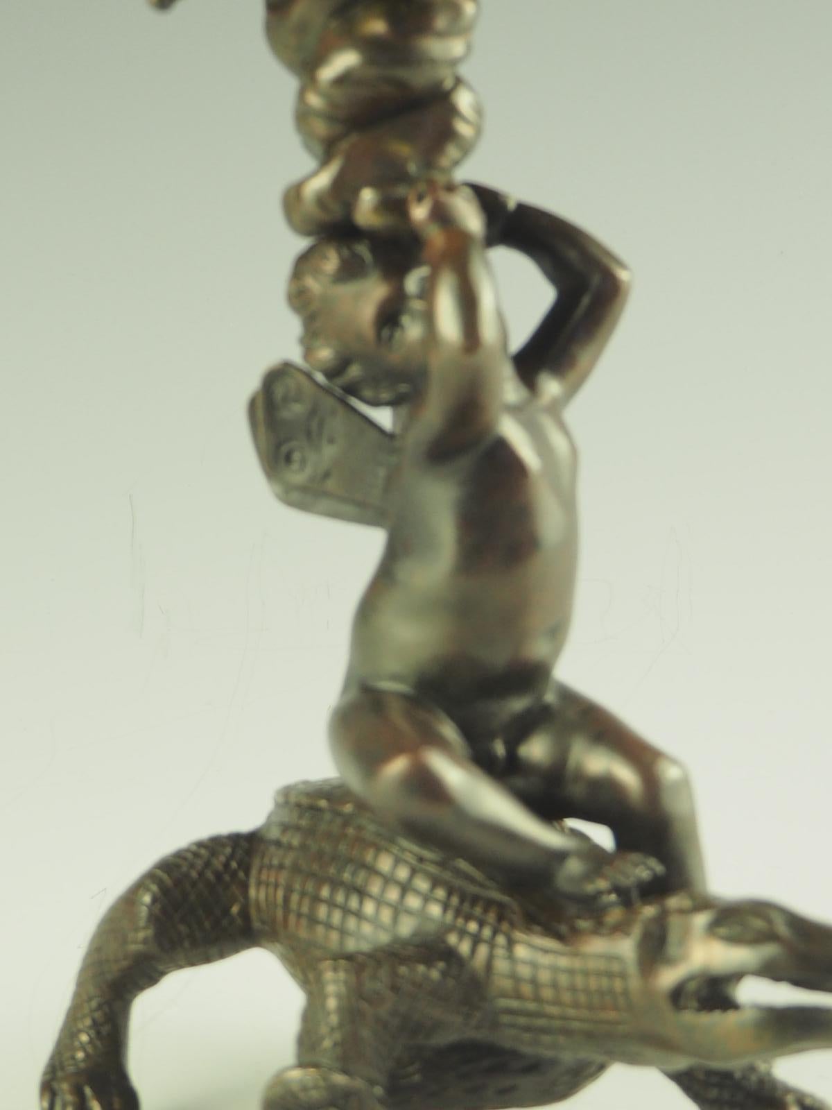 19th Century Bronze Putto Riding Crocodile Candlestick For Sale