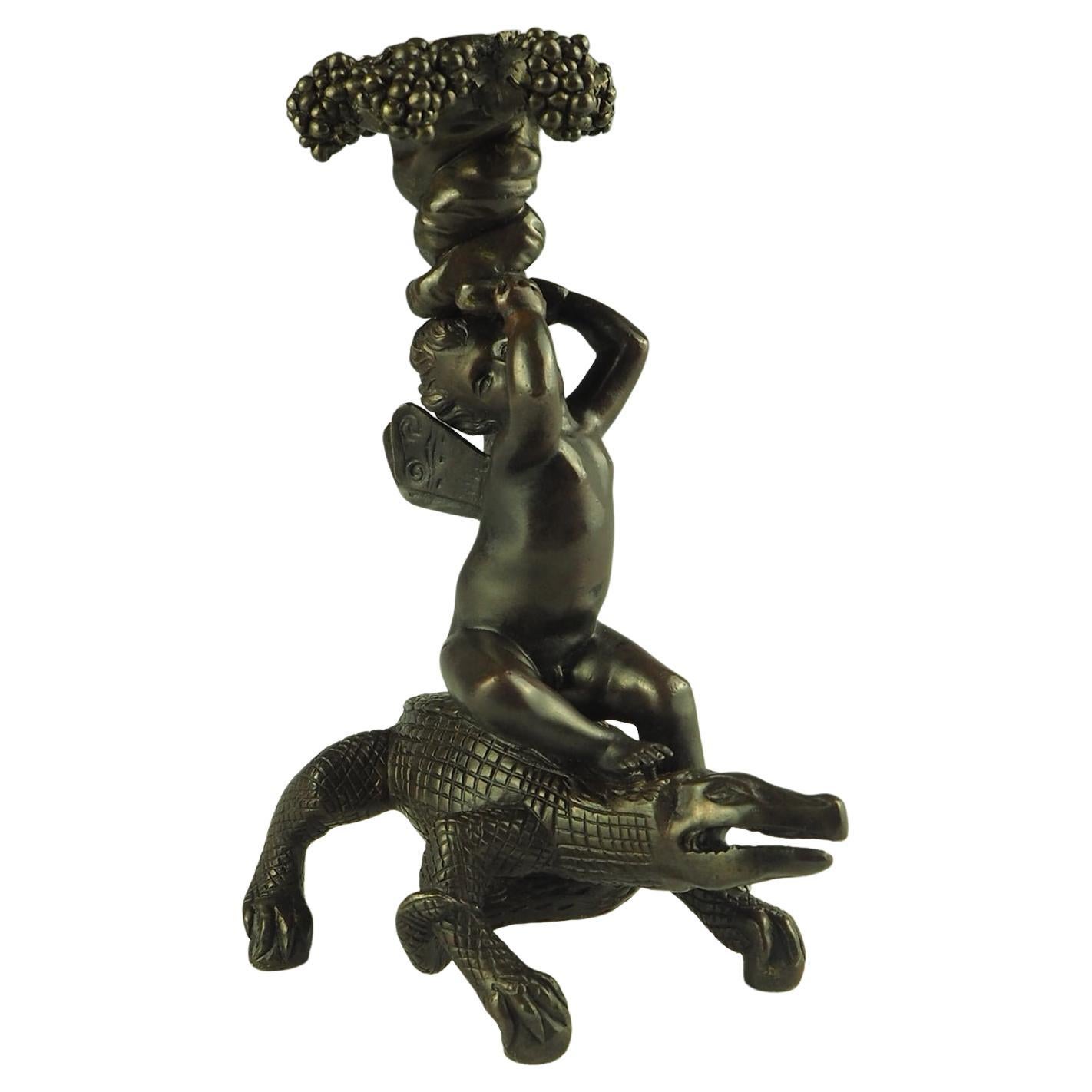 Bronze Putto Riding Crocodile Candlestick For Sale
