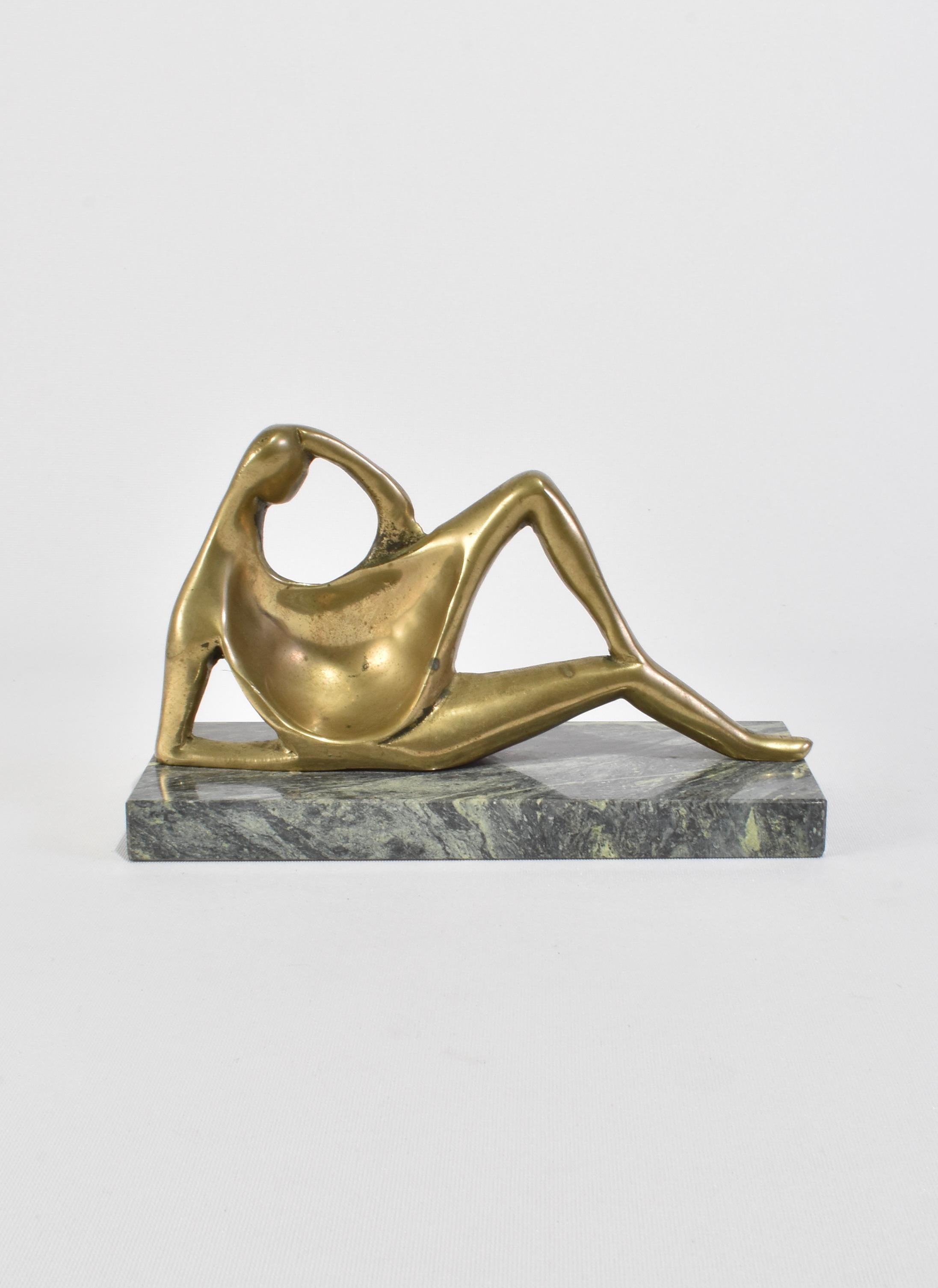 Rare, polished bronze reclining figure sculpture mounted on a green marble base, ca. 1960s. In the style of Henry Moore.