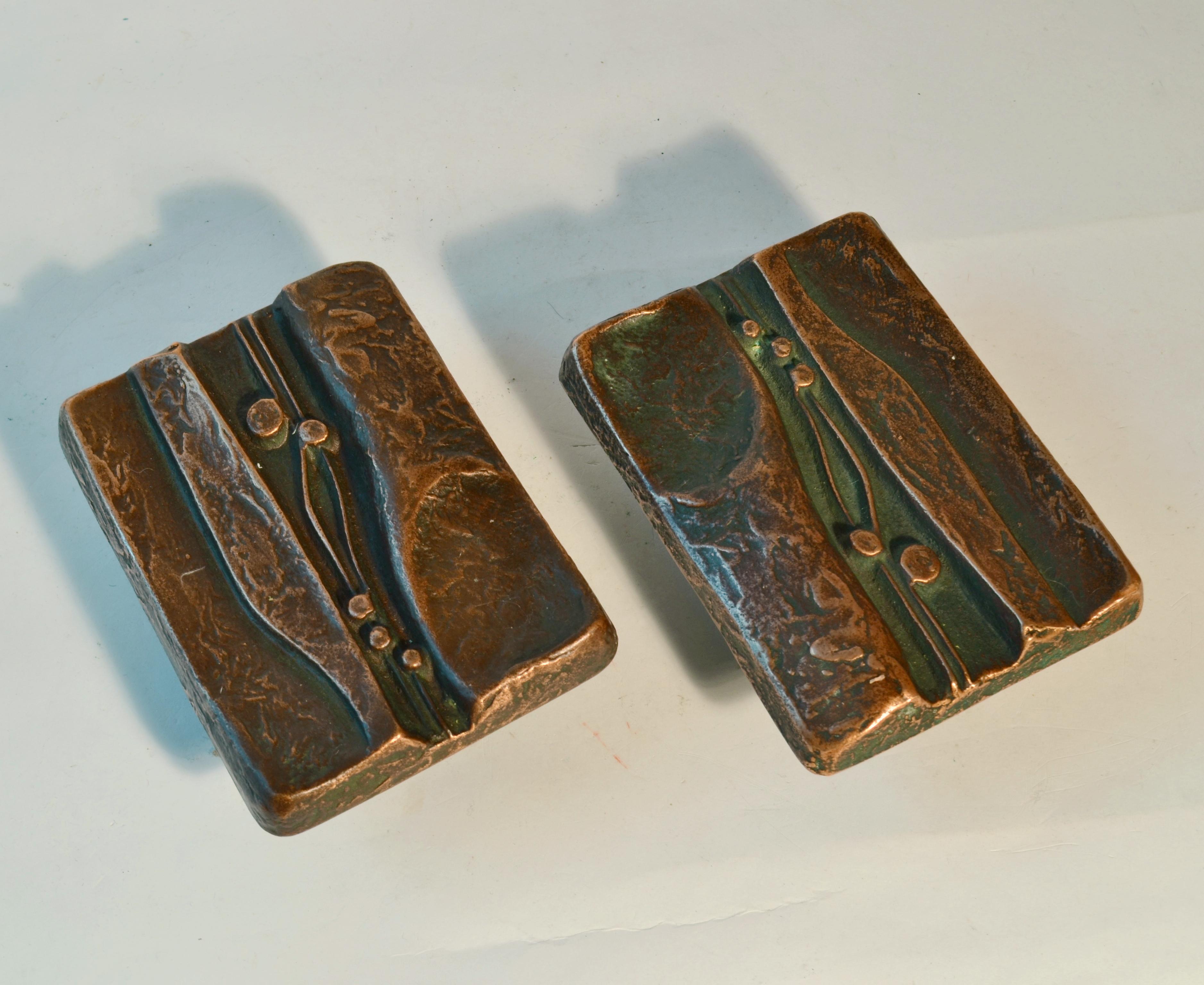 A set of two artistic Brutalist bronze door handles with textured design based on nature, which gives real personality touch to double doors. The handles are heavily textured and slightly curved, with lots of movement and depth in the design. They