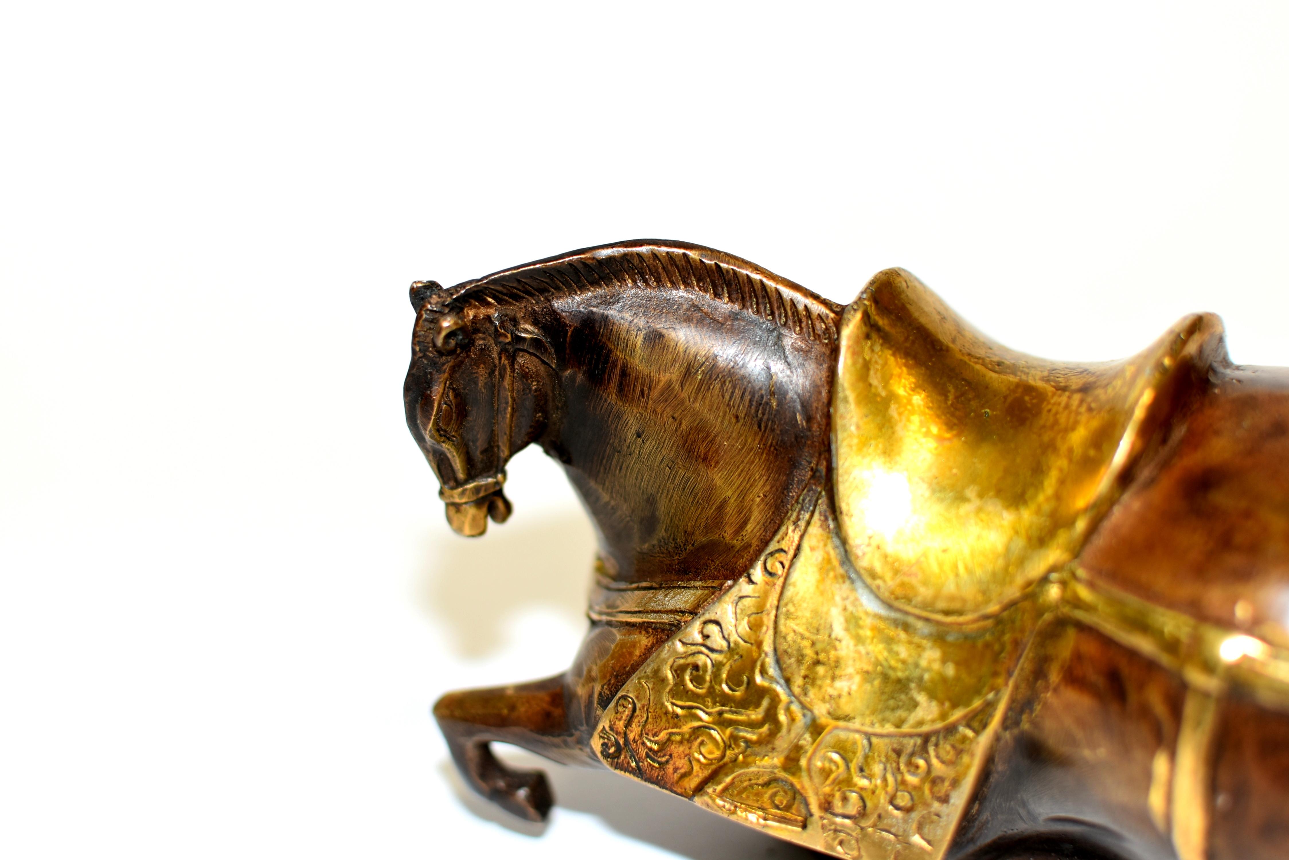 Chinese Bronze Recumbent Horse Han Style with Gilded Saddle For Sale