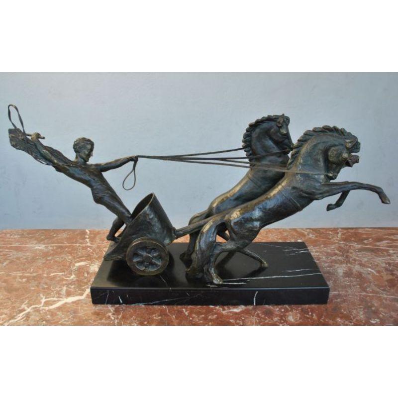 Neoclassical bronze representing a Roman Chariot launched at full gallop mounted on a marble terrace. by Michel Decoux. Dimension: height 54 cm, total length 96 cm for a depth of 25 cm.

Additional information:
Material: Bronze
Artist: Michael