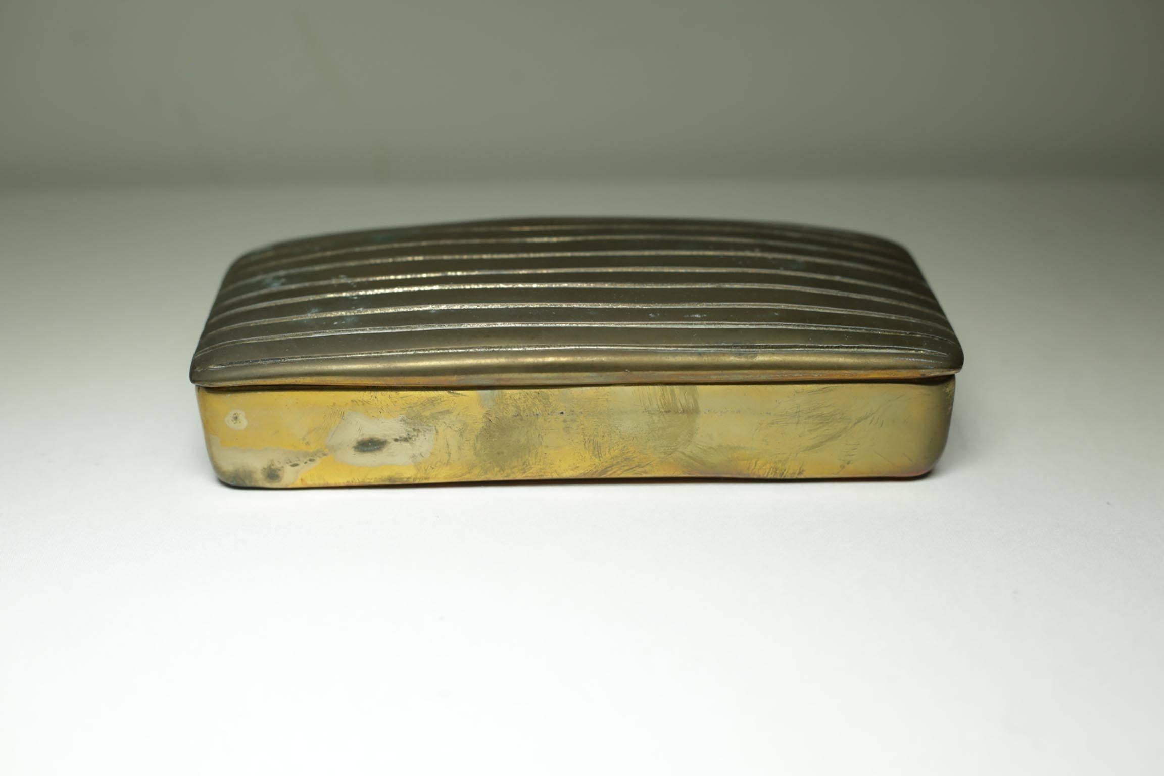 Very heavy bronze ribbed box with two compartments.