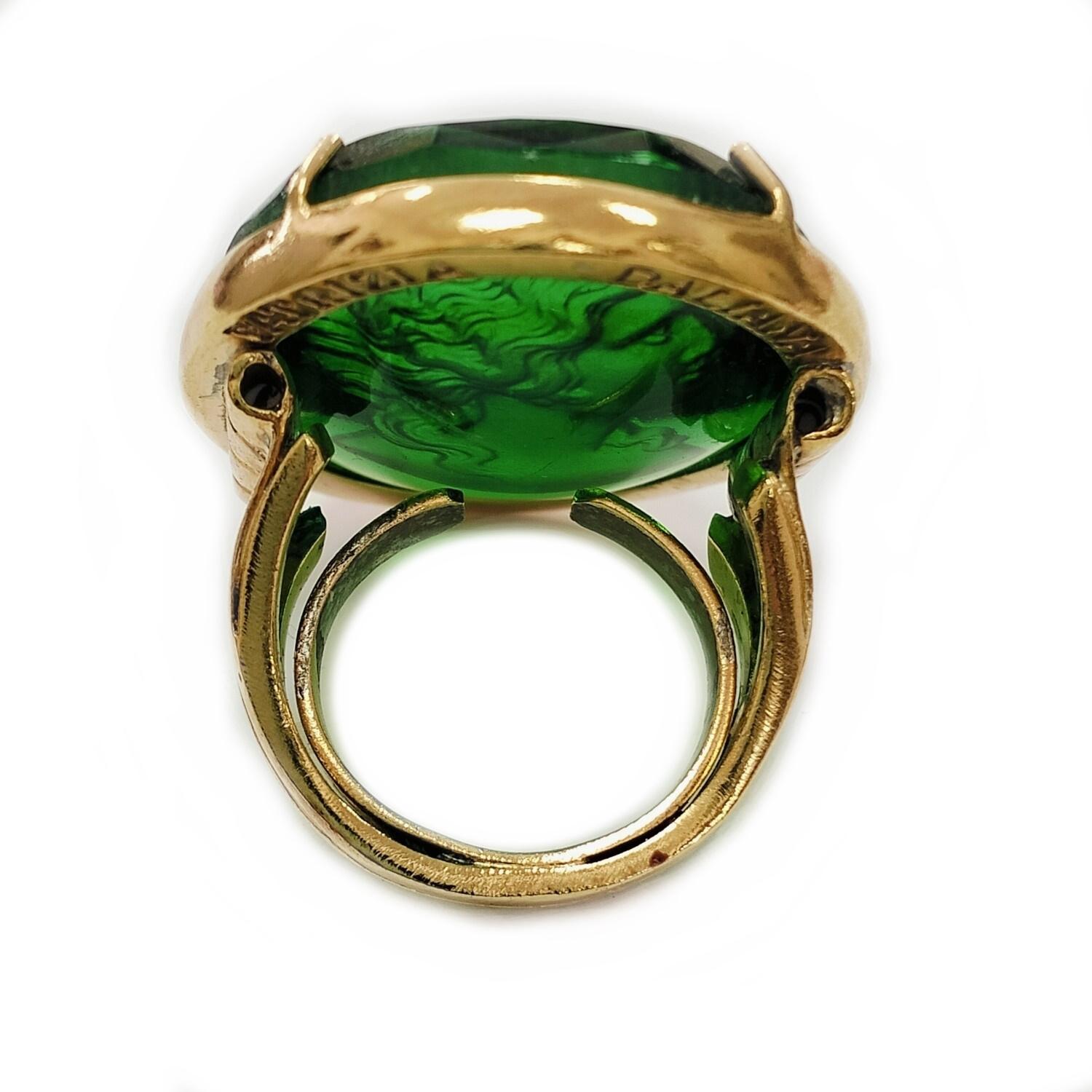 Patrizia Daliana Bronze ring embellished with 24 KT gold plating, with Green Murano glass Cameo depicting a woman. The setting has a neoclassical rope style workmanship. Inside the jewel there is a spring that allows the ring to adapt to the finger