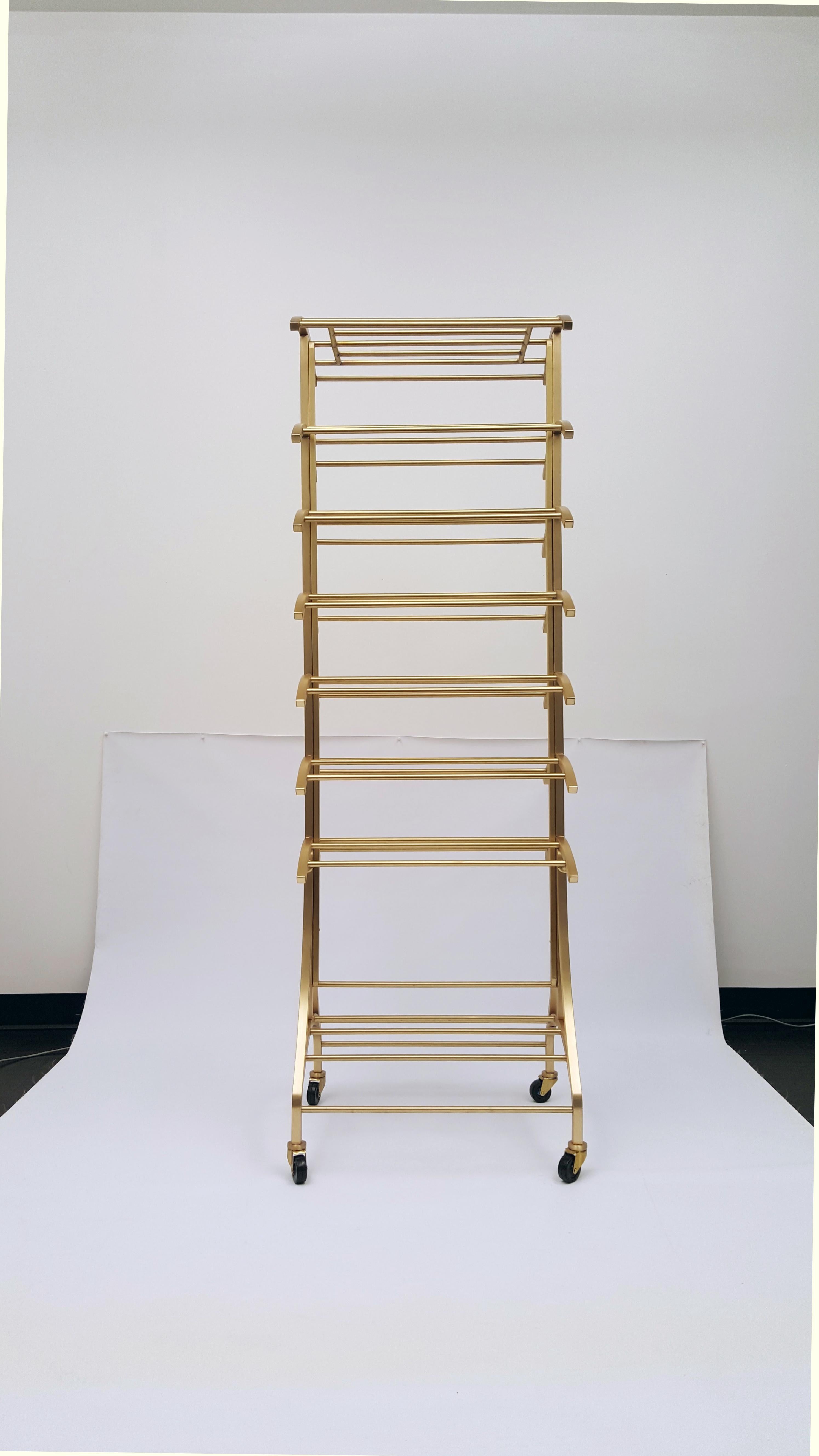 Beautifully handcrafted in our creative shop from solid architectural bronze. Removable wheels add flexibility and functionality. Aesthetically proportional curvature adds elegance to the piece.