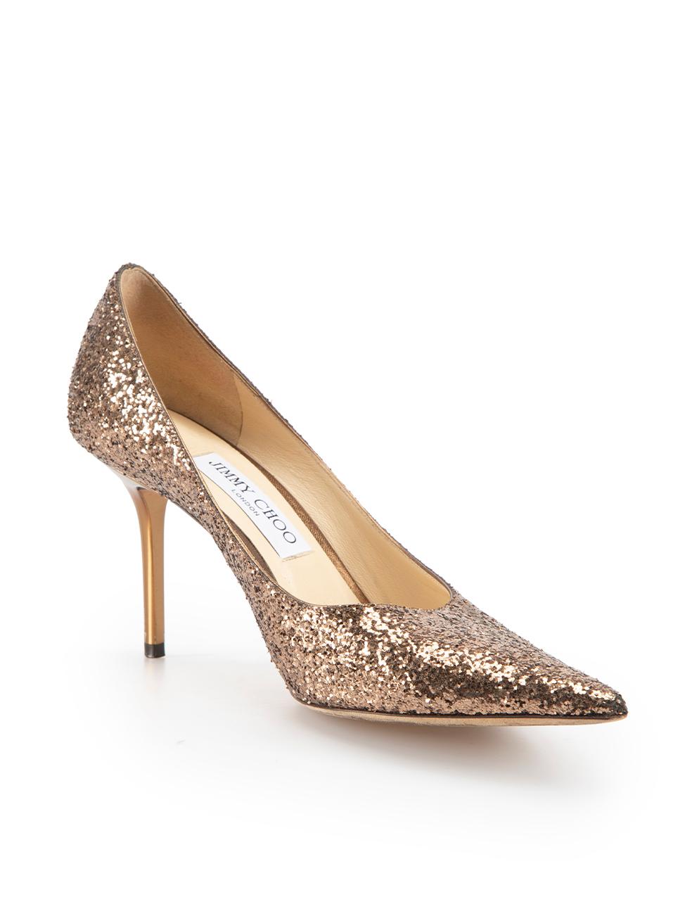 CONDITION is Very good. Minimal wear to pumps is evident. Minimal wear to both heel stems where scratch is evident on this used Jimmy Choo designer resale item.



Details


Bronze

Glitter

Pumps

High heeled

Point toe

Slip on

Bronze mirror