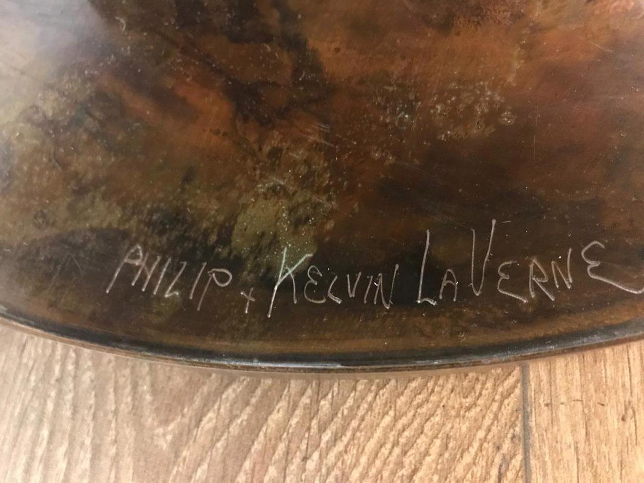 Round center table with etched, patinated, and polychromed bronze, Etruscan pattern. Etched signature to the base. Beautiful warm patina and excellent vintage condition.
By Philip and Kelvin Laverne.