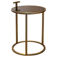 Mesa auxiliar redonda de bronce