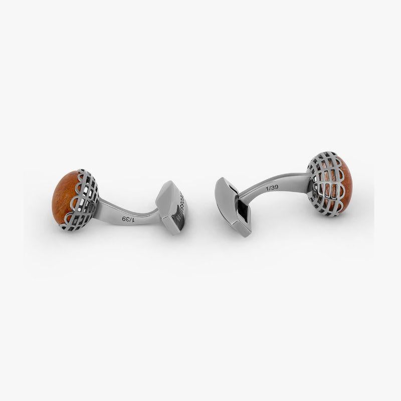Bronze Rutilated Quartz Rhodium Plated Sterling Silver Cufflinks, Limited Edition

Rutilated quartz is created when needle-like inclusions of rutile form within a quartz stone to create star-like patterns. These limited edition cufflinks feature