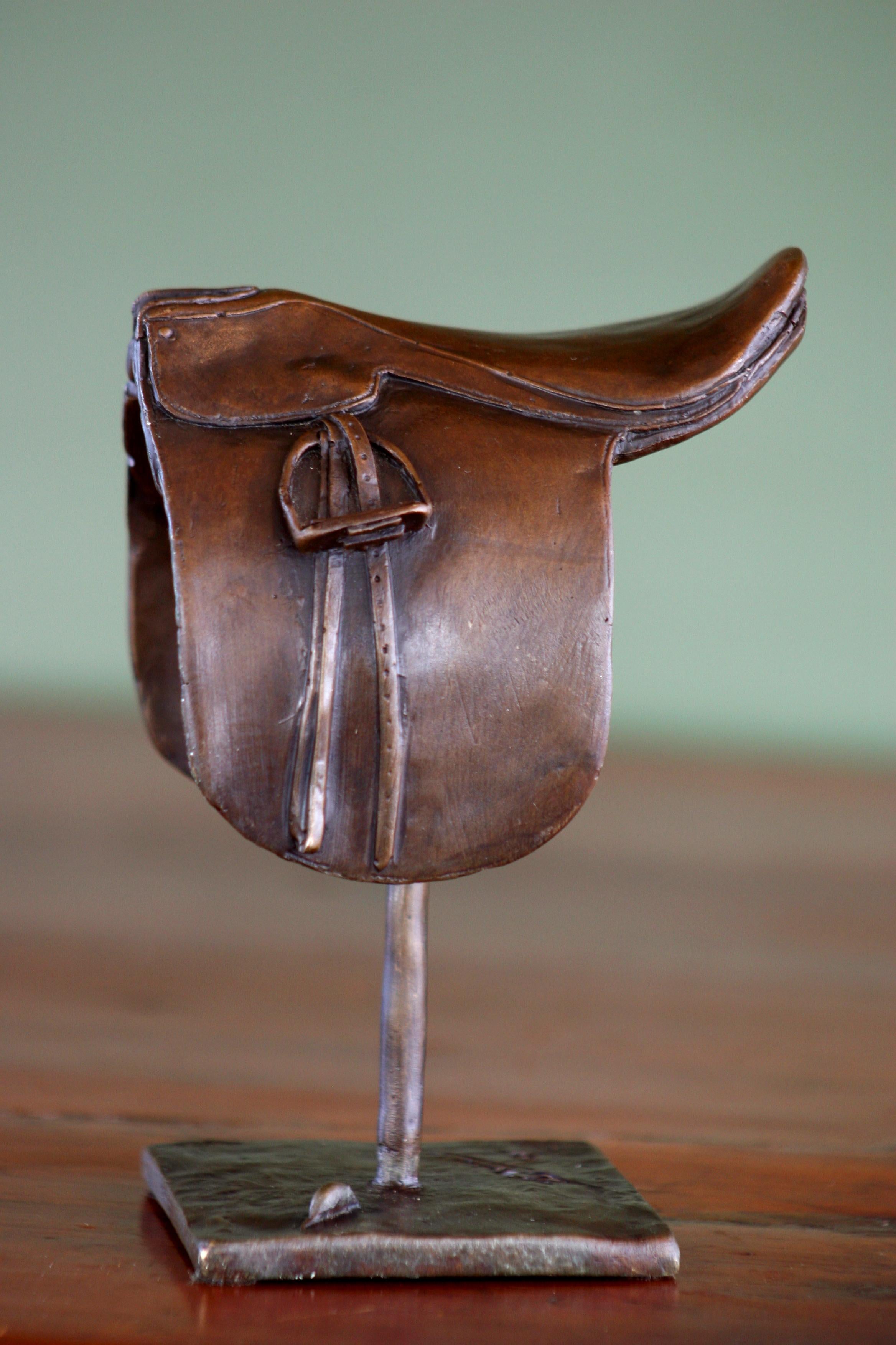Splendid bronze Saddle cut-back with authentic equestrian details, by renowned artist Douwe Blumberg.
 