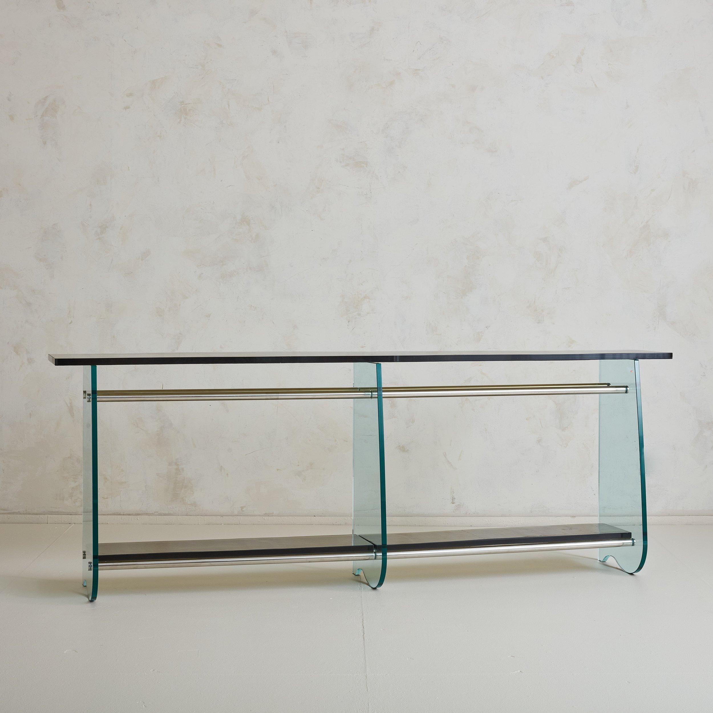 Sourced in Paris, the stunning glass console table was custom designed for an architects office in 1979. Saint Gobain has been manufacturing glass in a small village in northern France since 1693. The mirrors in the famous Hall of Mirrors in the